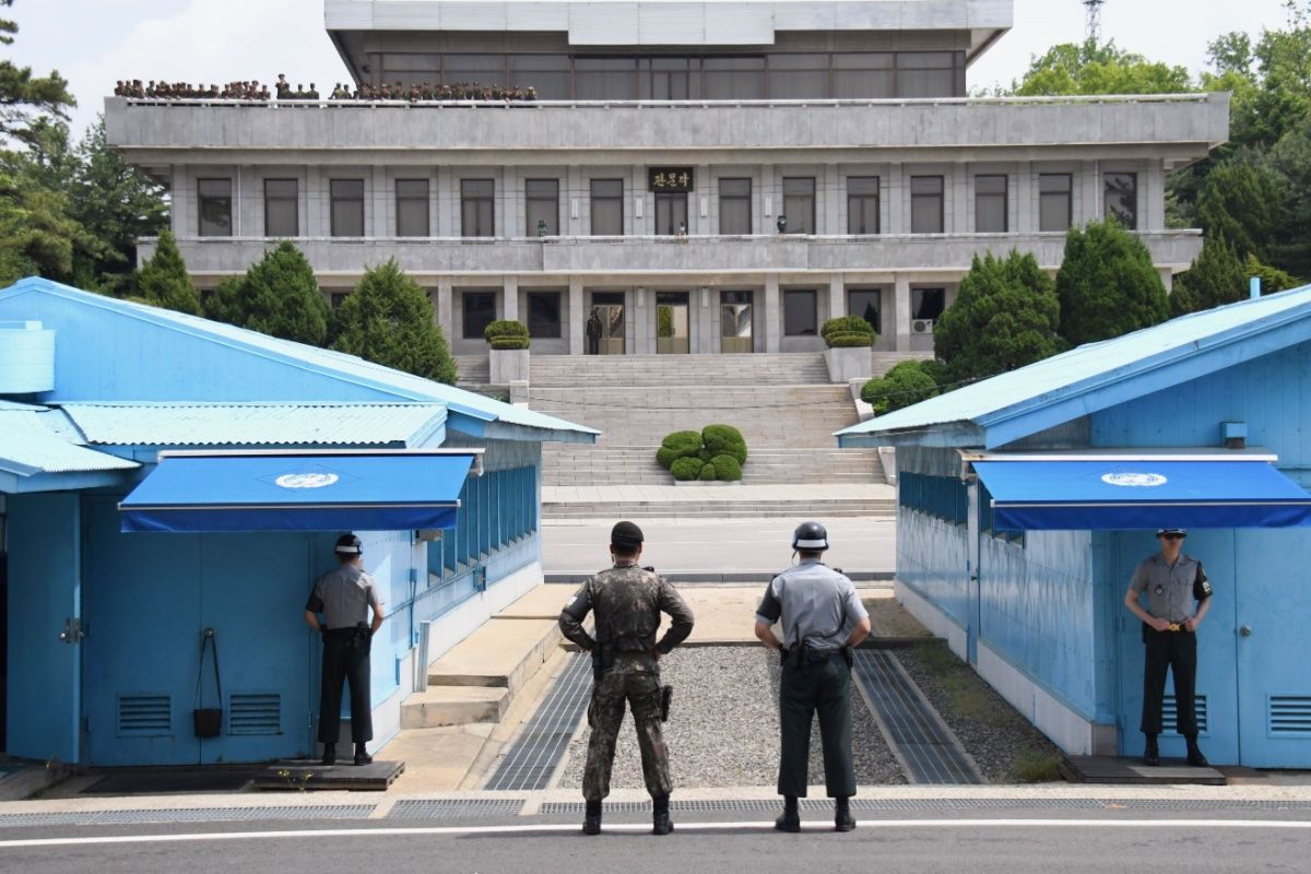 UN soldiers standing in front of the North Korea office building at Korean Demilitarized Zone