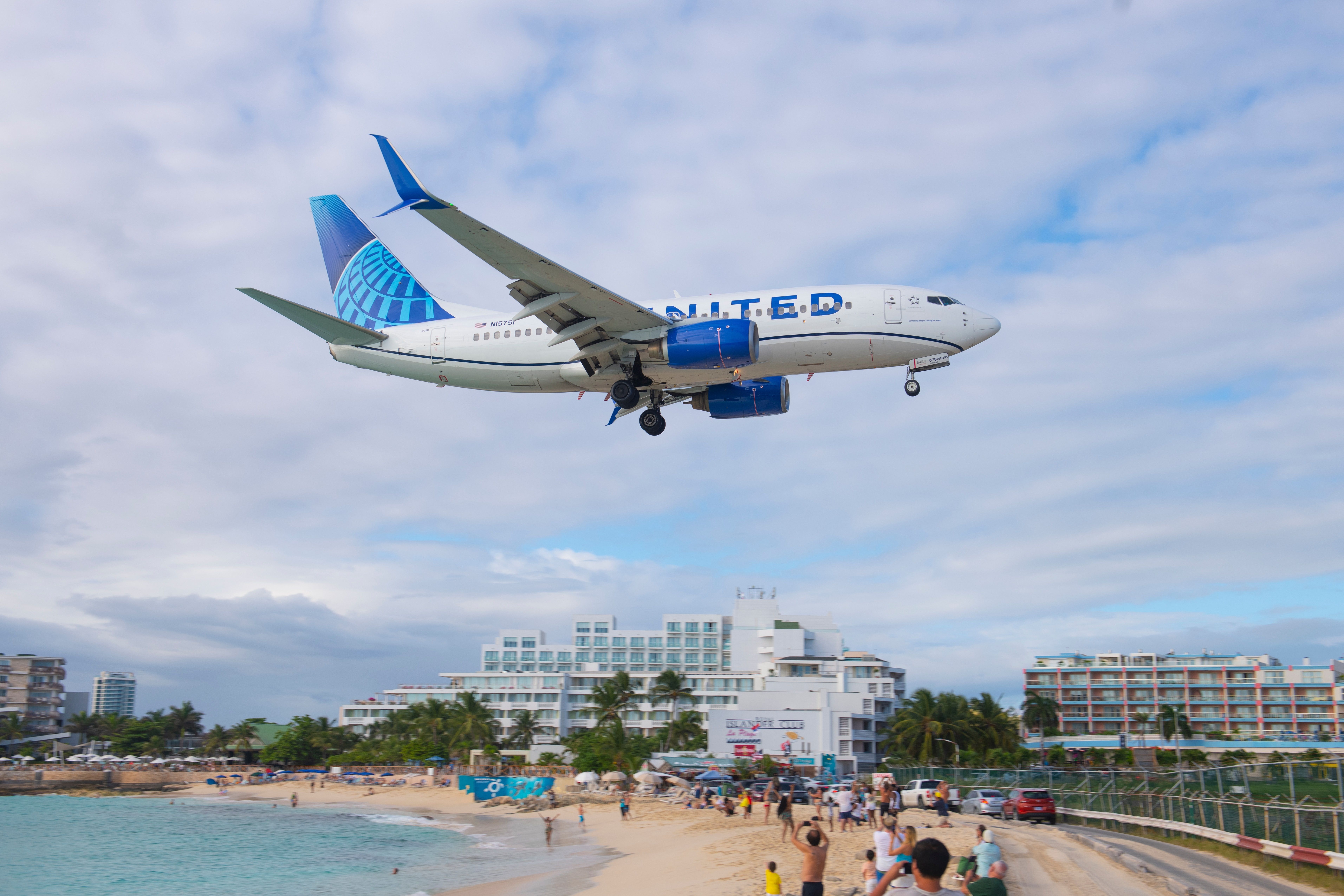 United 737-700 landing St Maarten shutterstock_2397128847