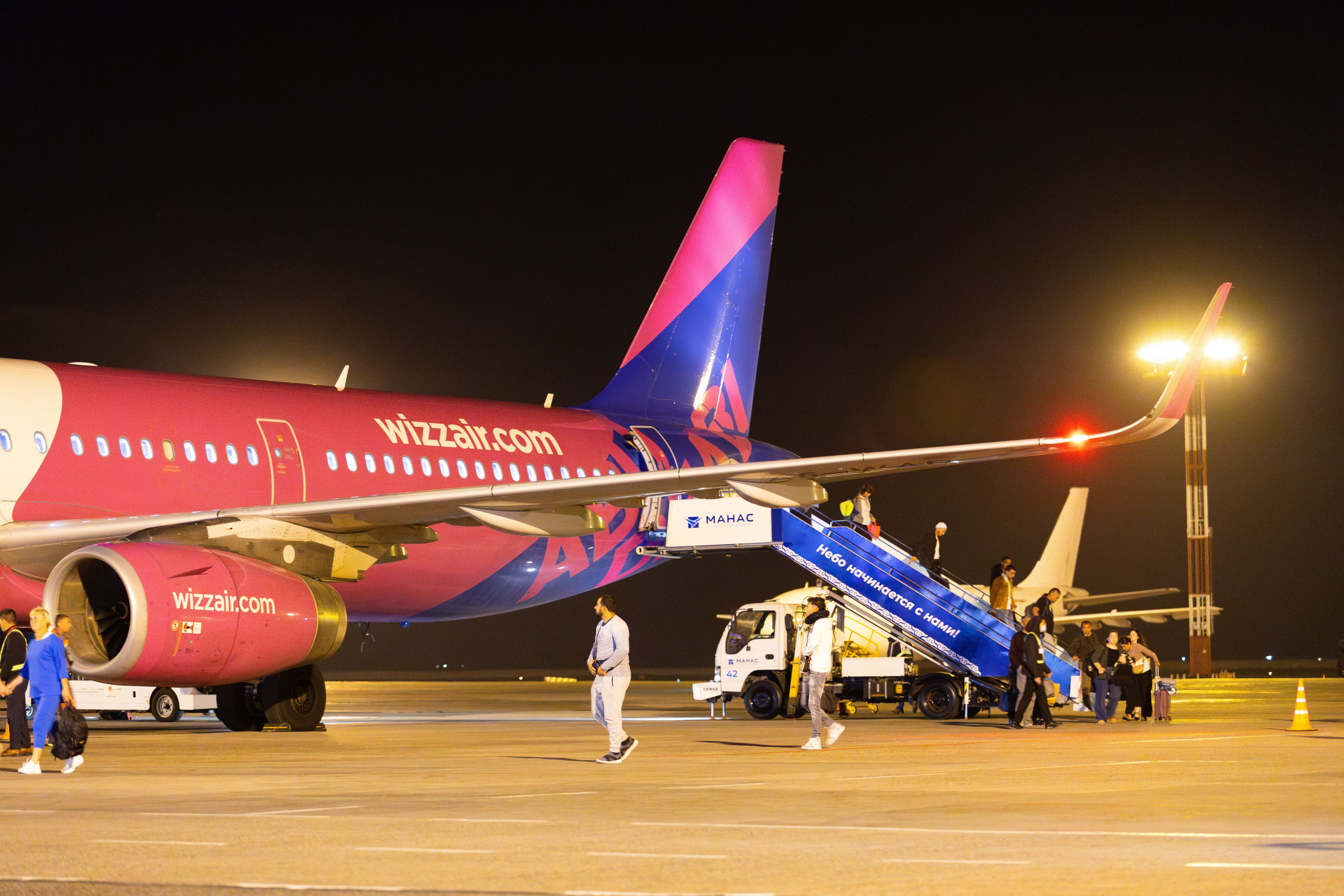 Wizz Air A321 on the ground at night shutterstock_2418442913