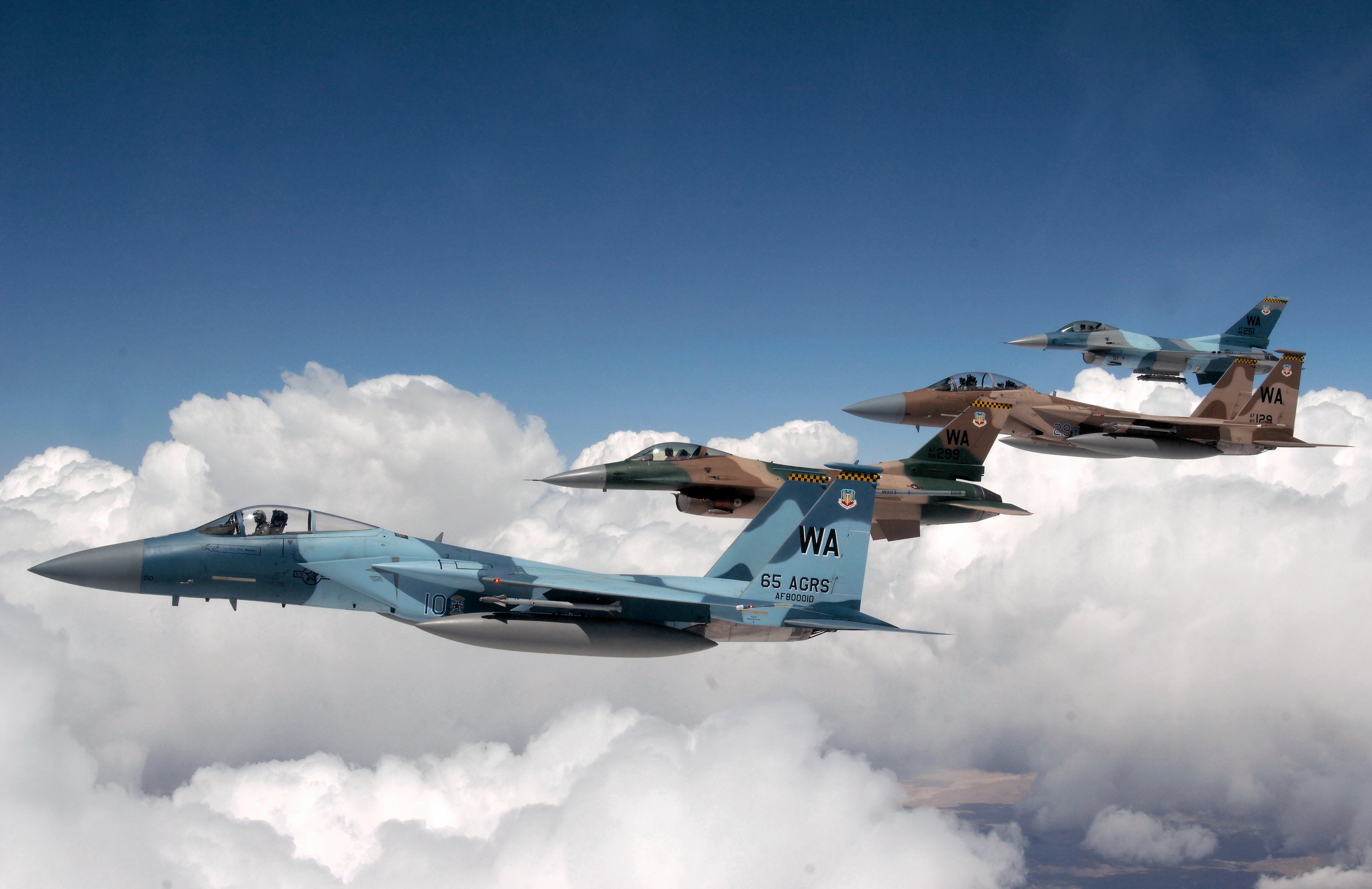 A flight of Aggressor F-15 Eagles and F-16 Fighting Falcons fly in formation June 5 over the Nevada Test and Training Range. 