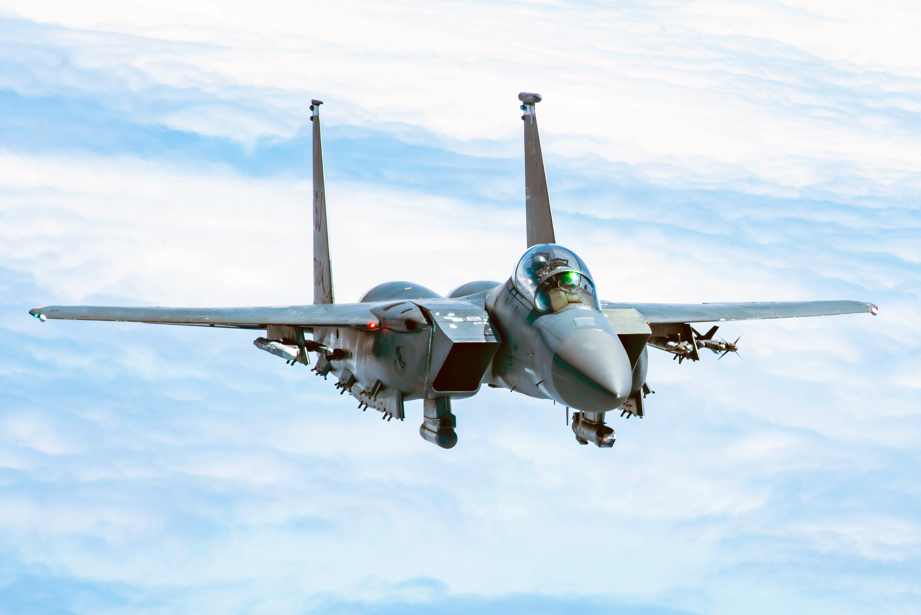 An F-15E Strike Eagle with the 4th Fighter Wing approaches a KC-135 Stratotanker from the 121st Air Refueling Wing to be refueled over the skies of North Carolina,