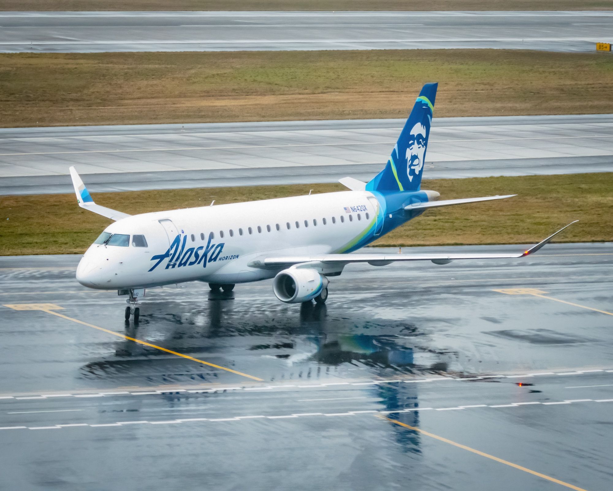 A Horizon Air Embraer E175 approaches its gate at Portland International Airport.