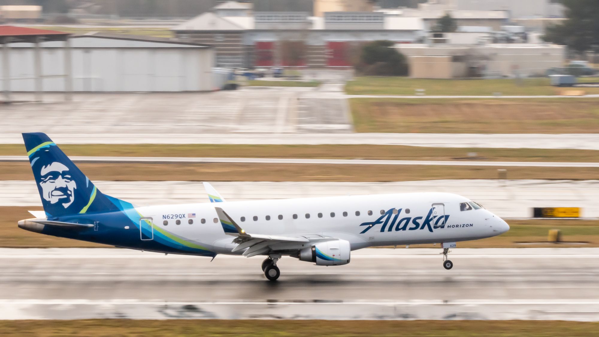 A Horizon Air Embraer E175 lands at Portland International Airport (PDX).