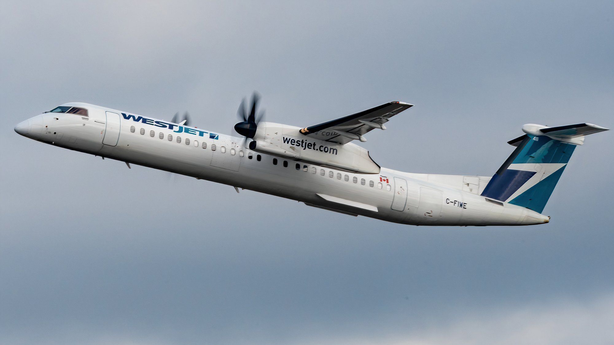 2MP_of_WestJet Encore Q400 Rising With Prop Blur Under Portlandia Overcast_01