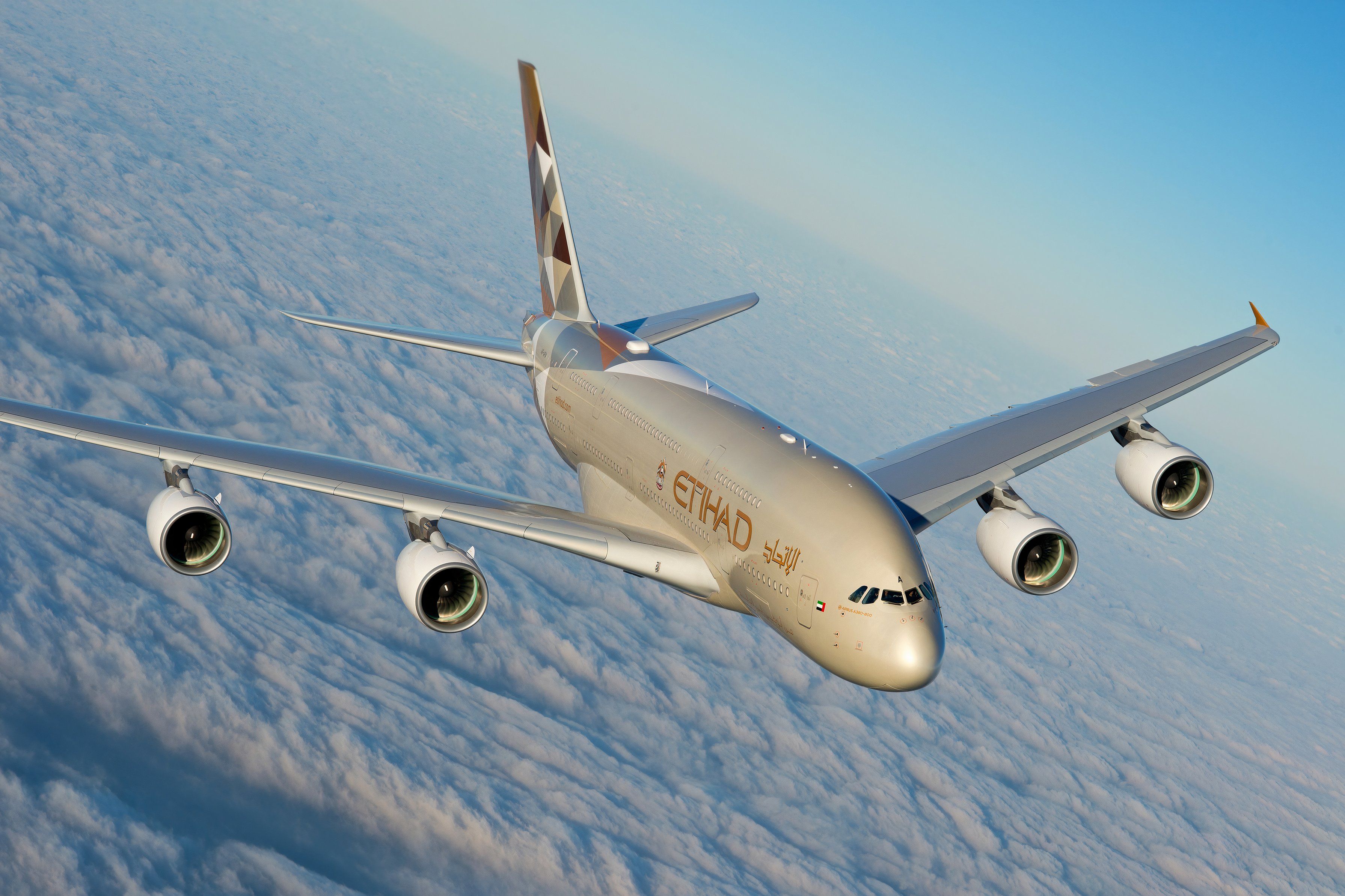 An Etihad Airways Airbus A380 above the clouds 