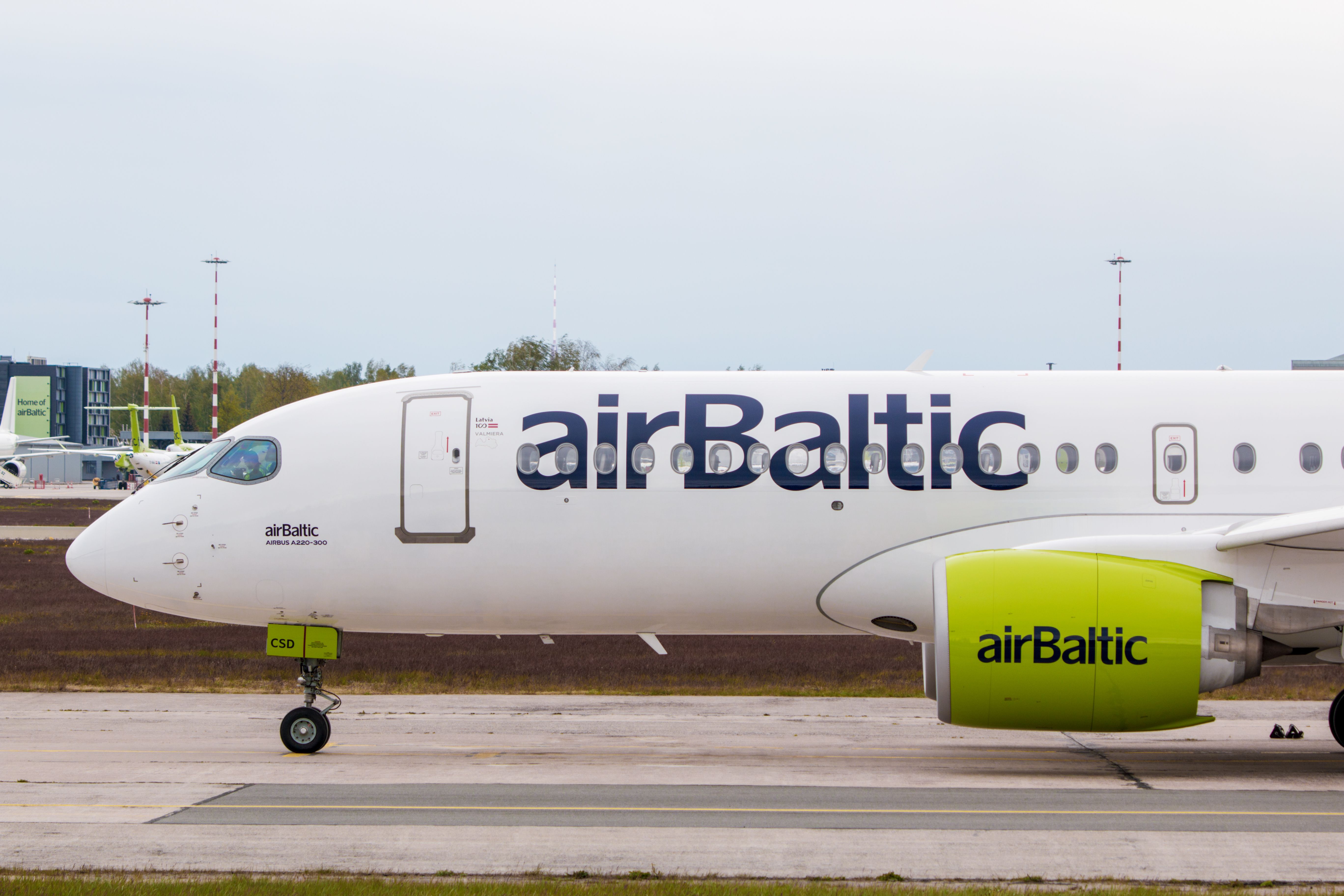 airBaltic Airbus A220-300 taxiing at RIX shutterstock_1737386054