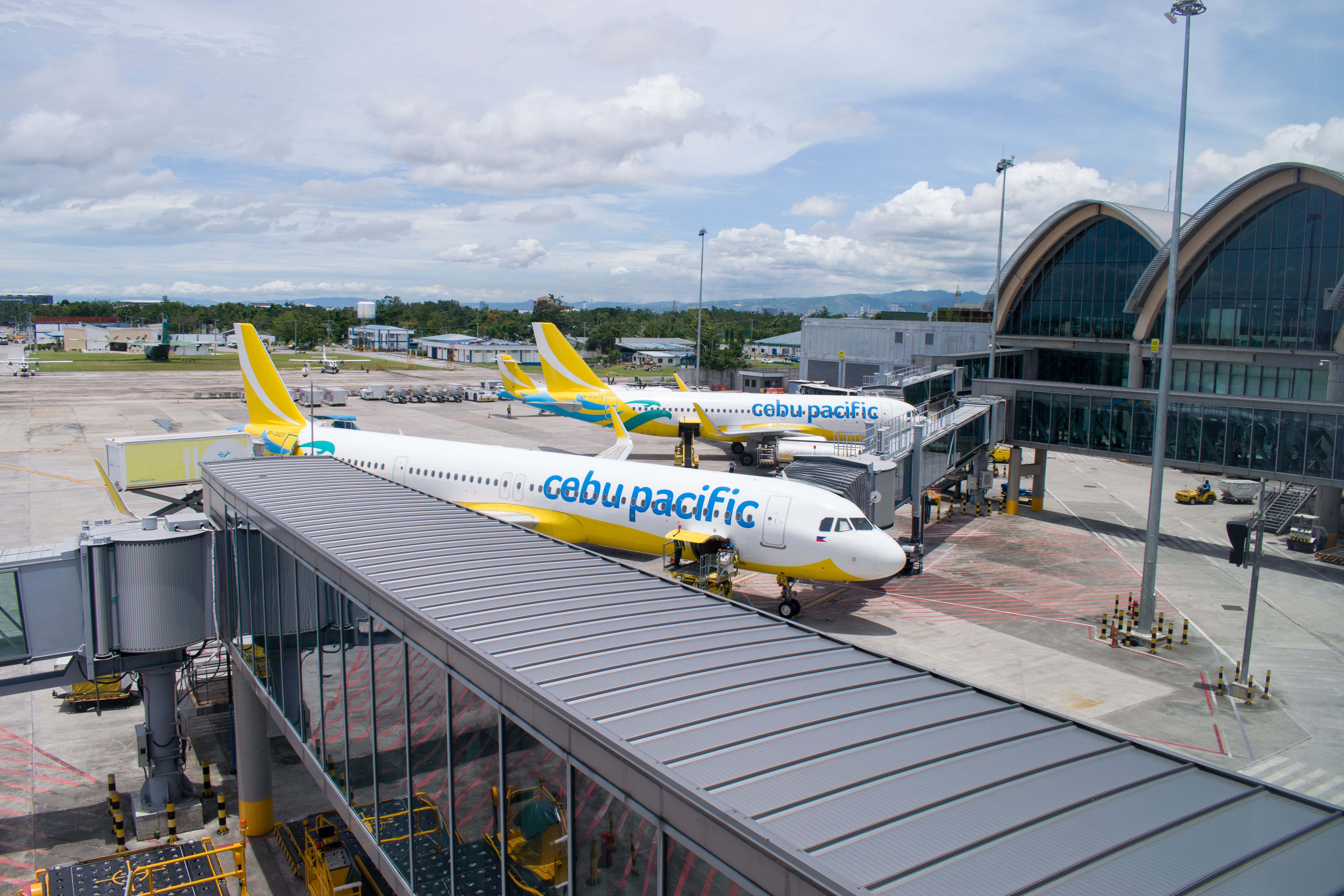 Cebu Pacific Air aircraft parked at the gates shutterstock_2151045773