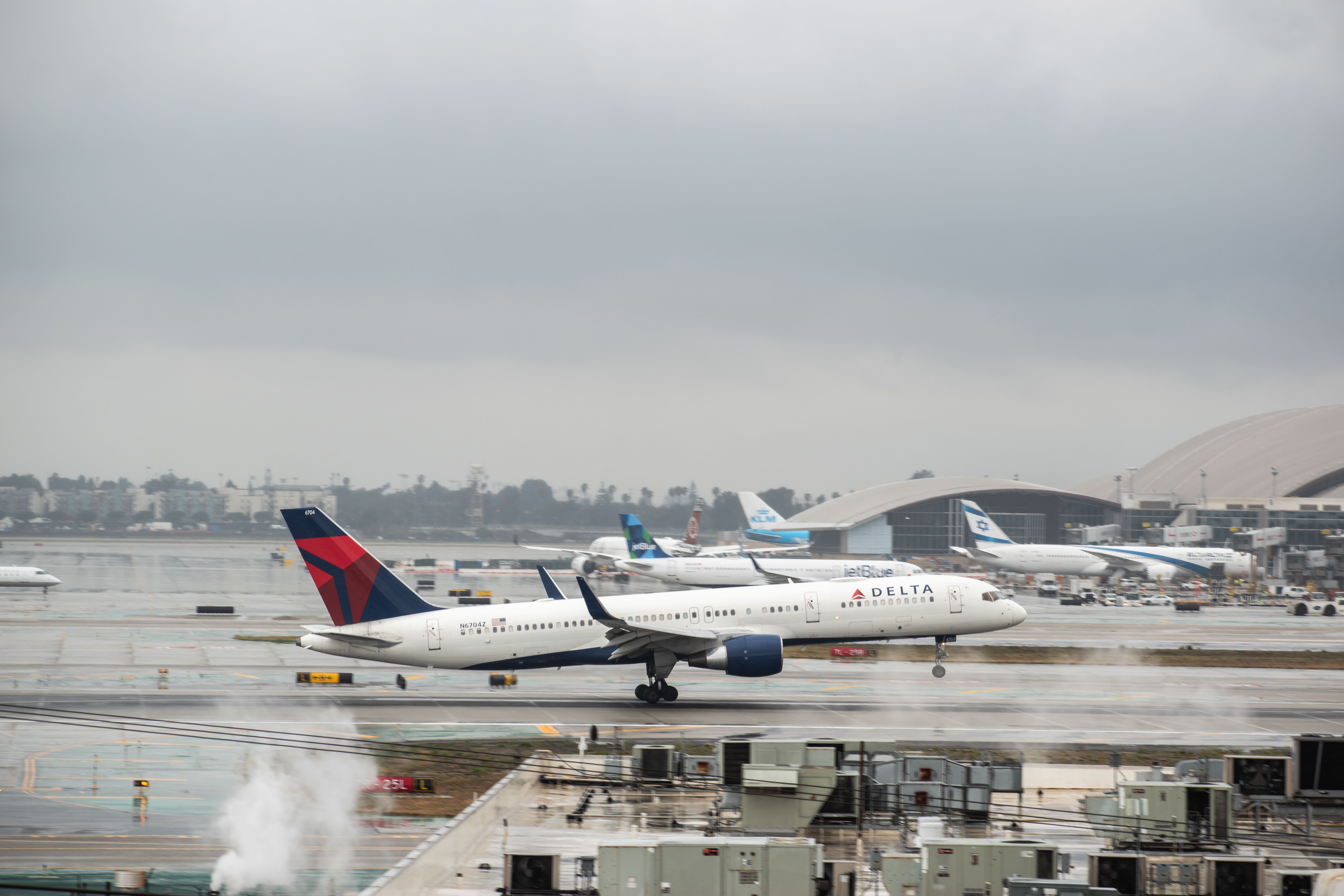 Delta Air Lines Boeing 757 departing rainy LAX shutterstock_1677230287