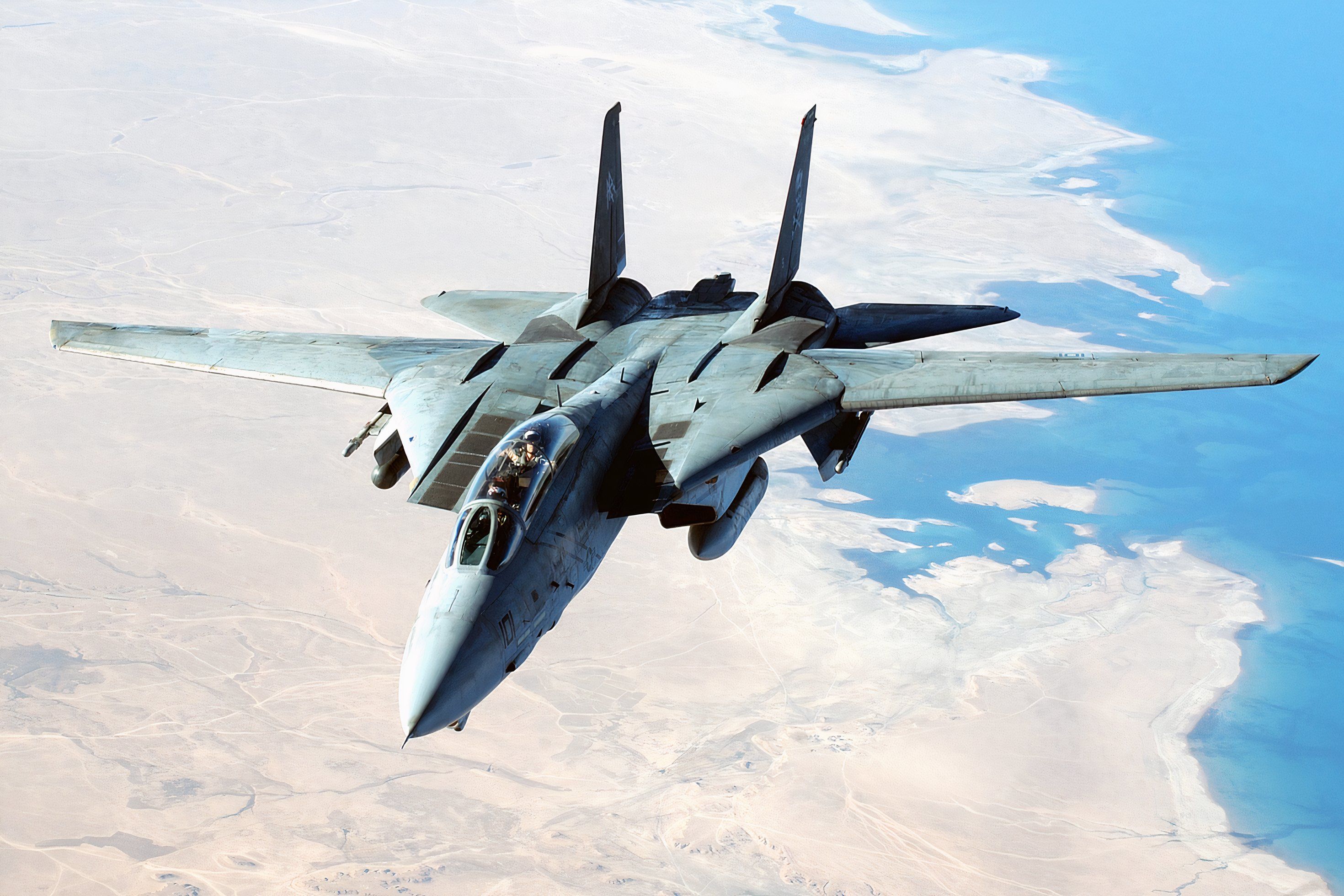 A US Navy (USN) F-14 Tomcat aircraft flies a combat mission in support of Operation Iraqi Freedom.