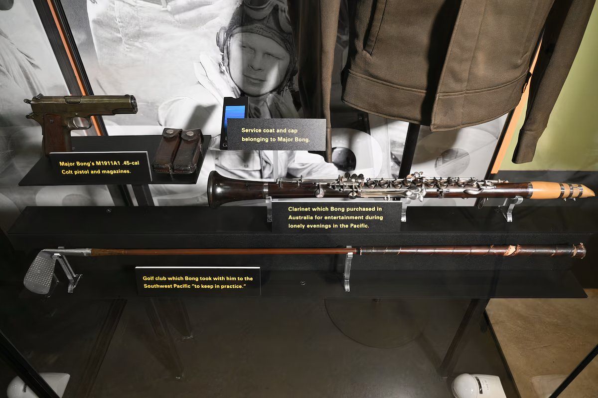 Photo of Richard Bong's handgun, clarinet, and golf club