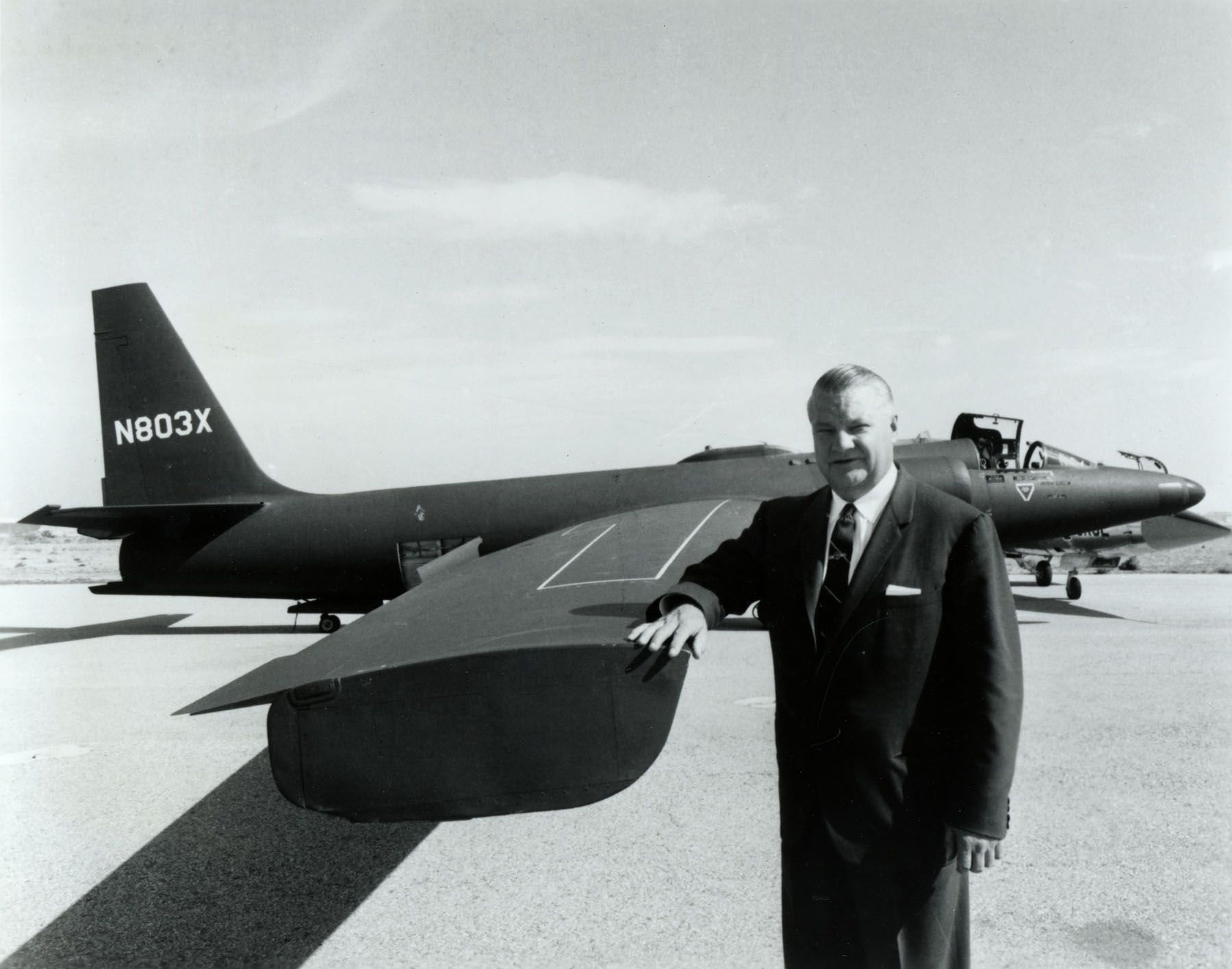 Photo of U-2 designer Clarence Johnson alongside a U-2 aircraft
