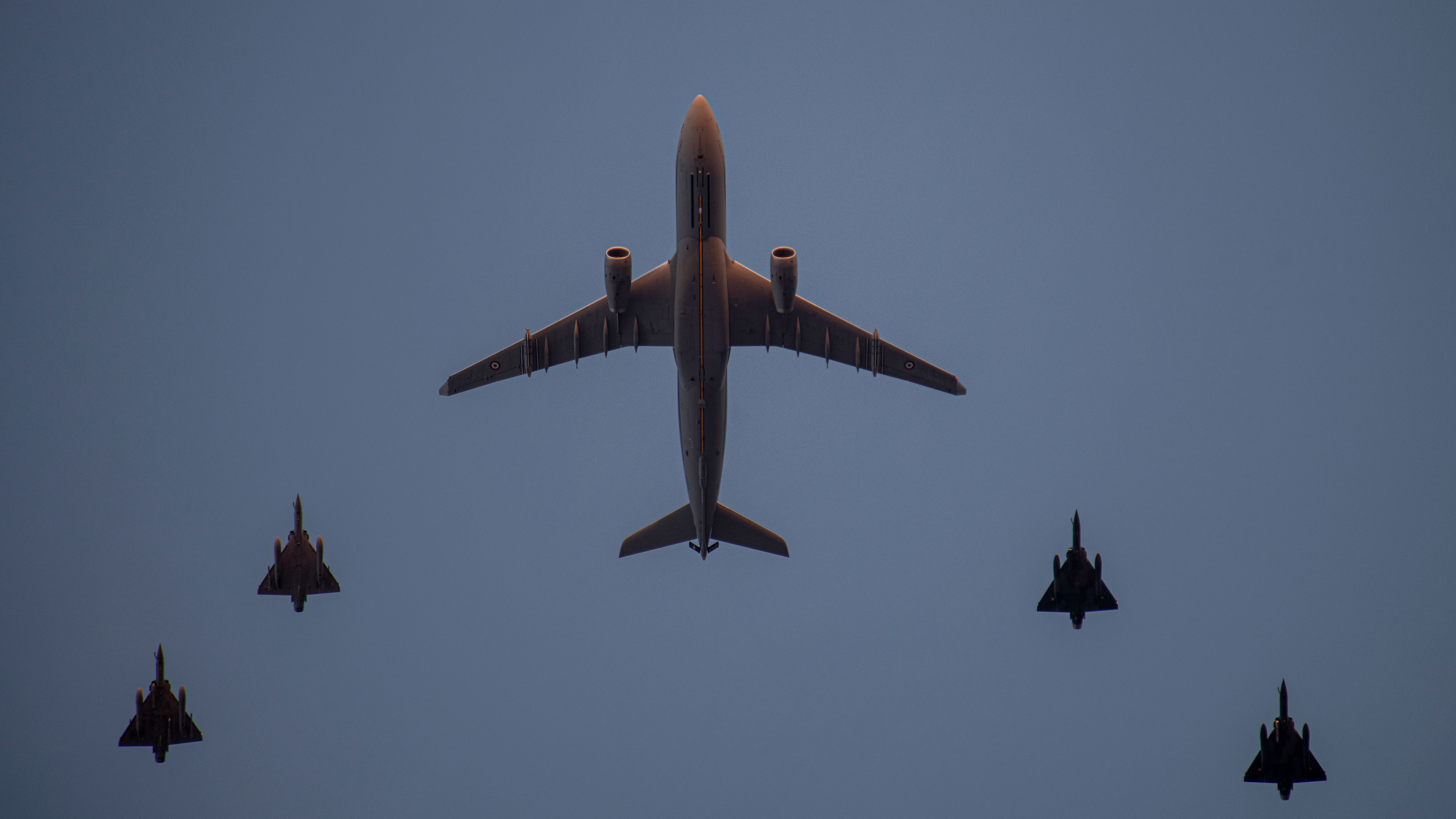 A330-MRTT flying in formation with fighter aircraft