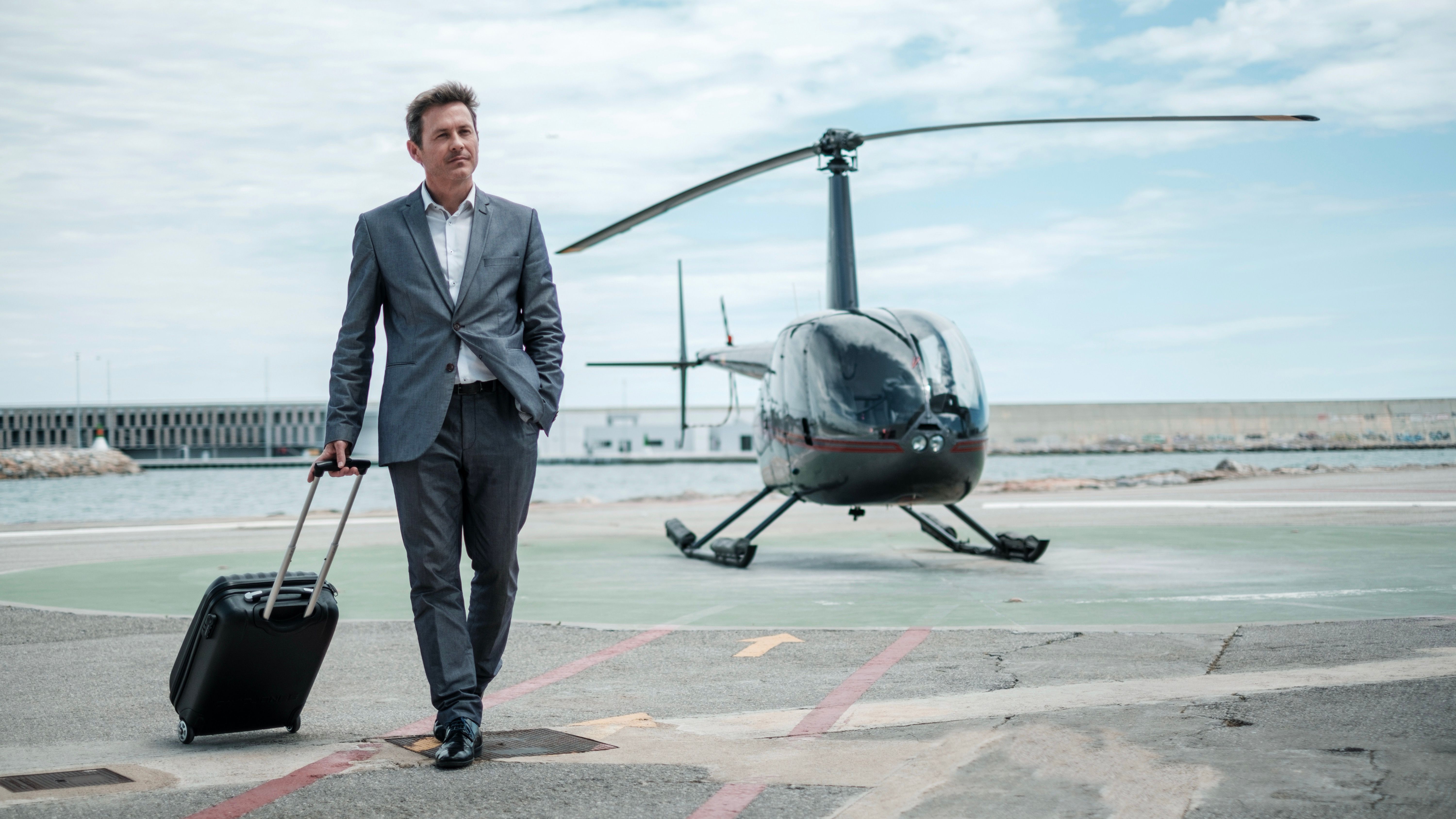 businessman walking from helicopter