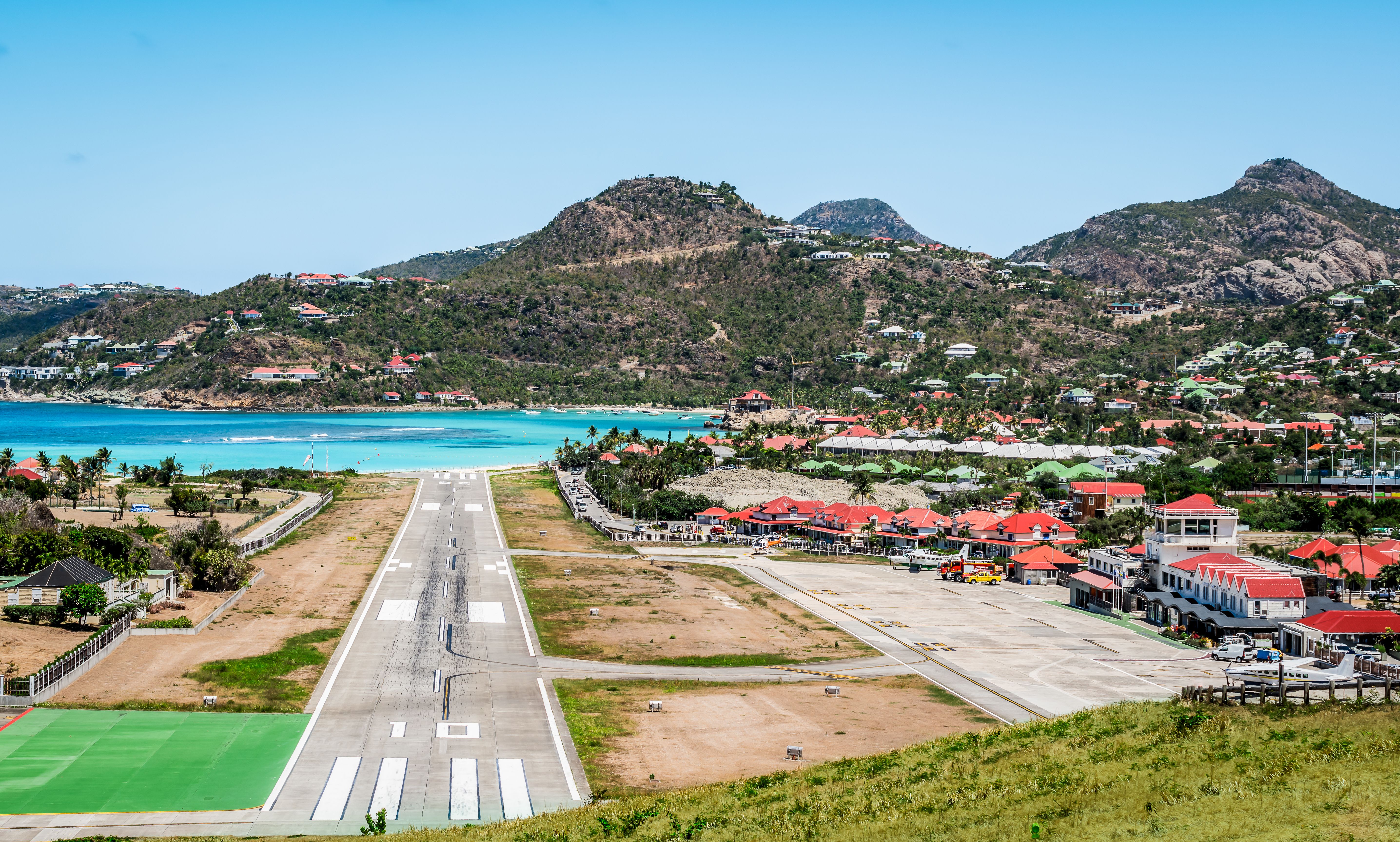 Landscape with village and runway of St Jean on the Caribbean island of Saint Barthélemy ( St Barts ).