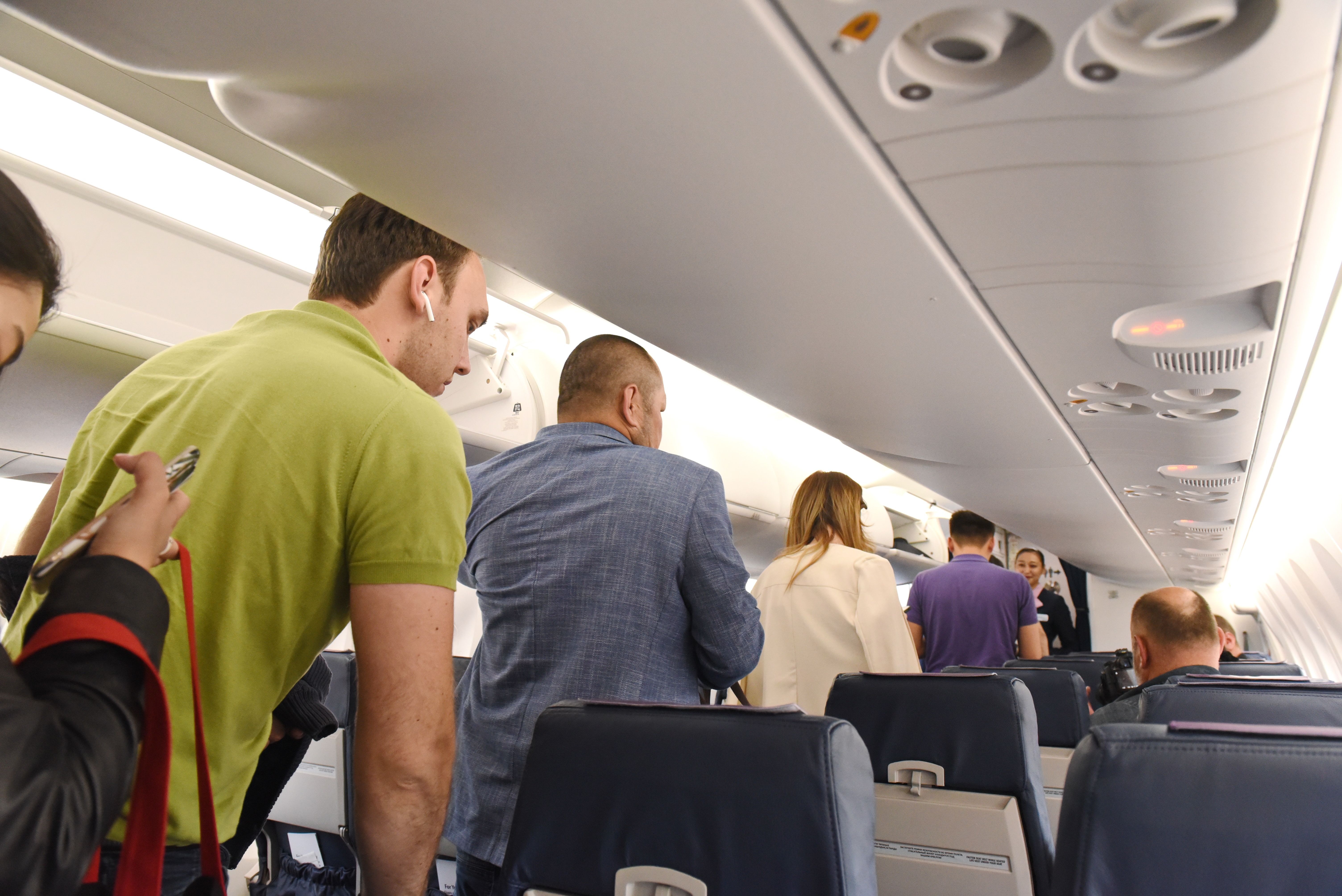 people standing up on a plane