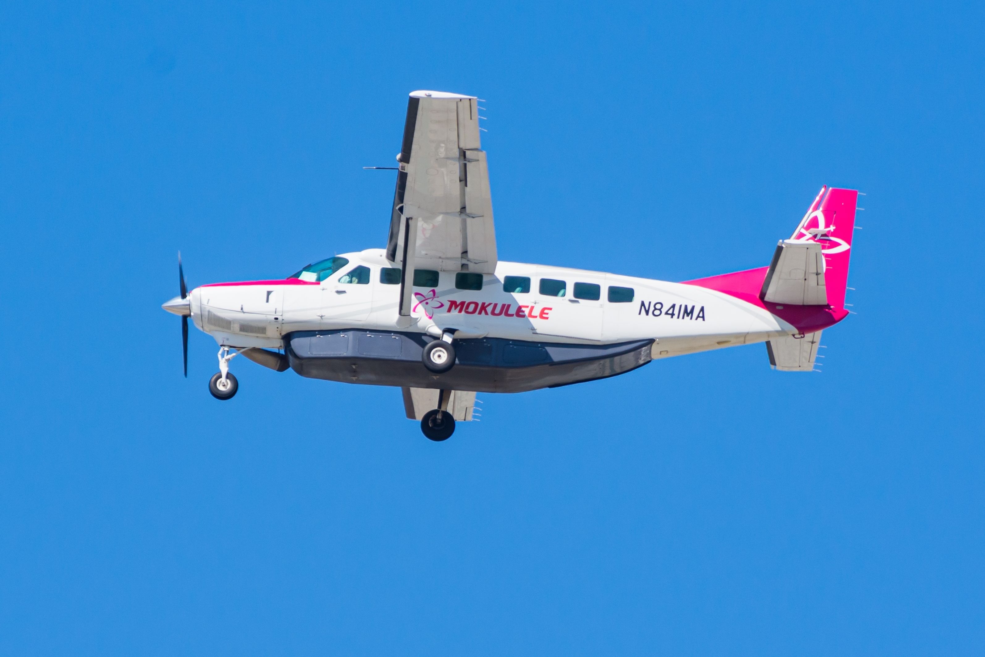 A Mokulele Airlines Cessna 208 Grand Caravan flying the sky