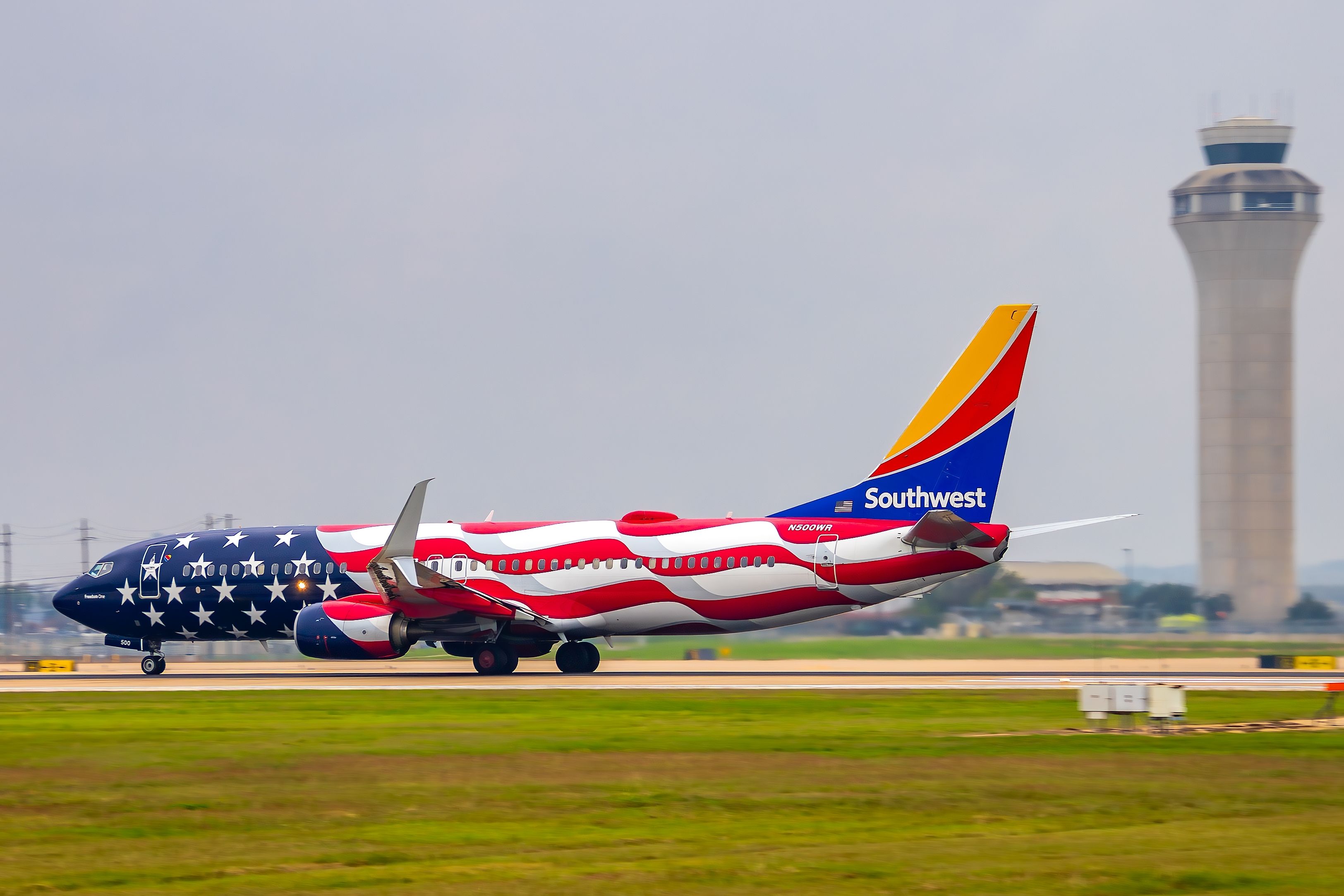 A Southwest Airlines 737-800 wearing the Freedom one paint shame departing Runway 18L at Austin-Bergstrom International Airport (AUS)