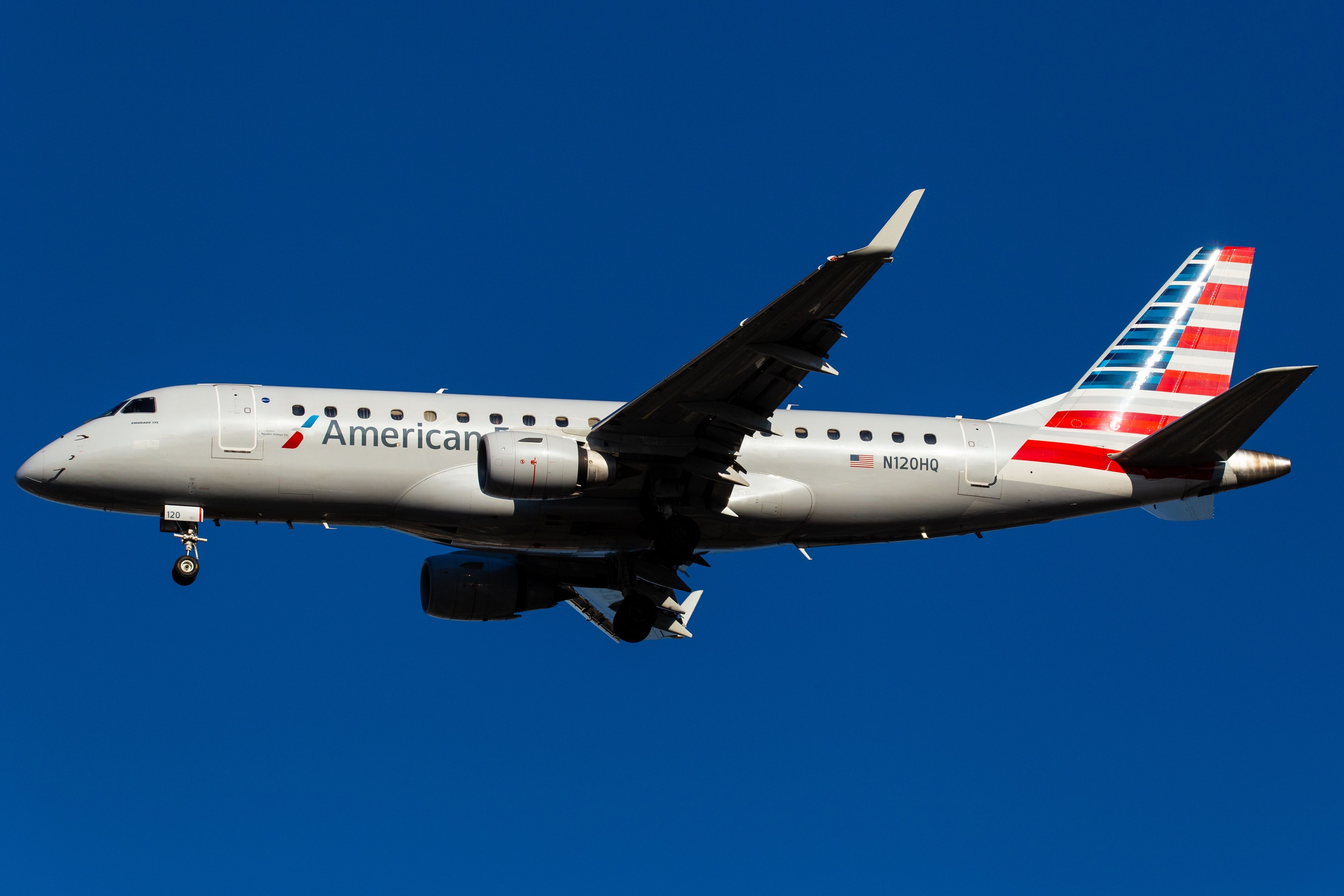 An American Eagle Embraer E175 flying in the sky