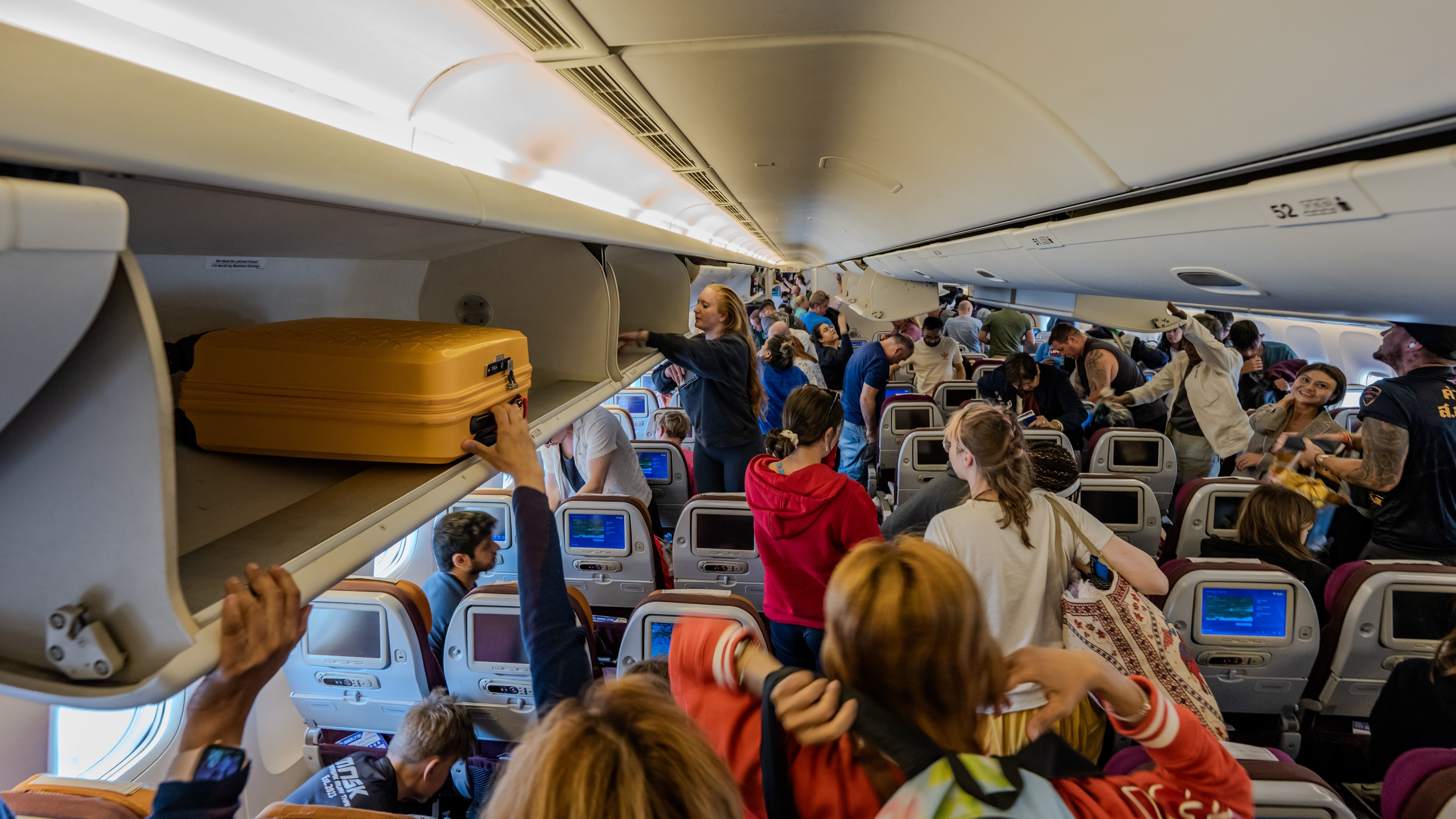 Passengers boarding a wide-body aircraft