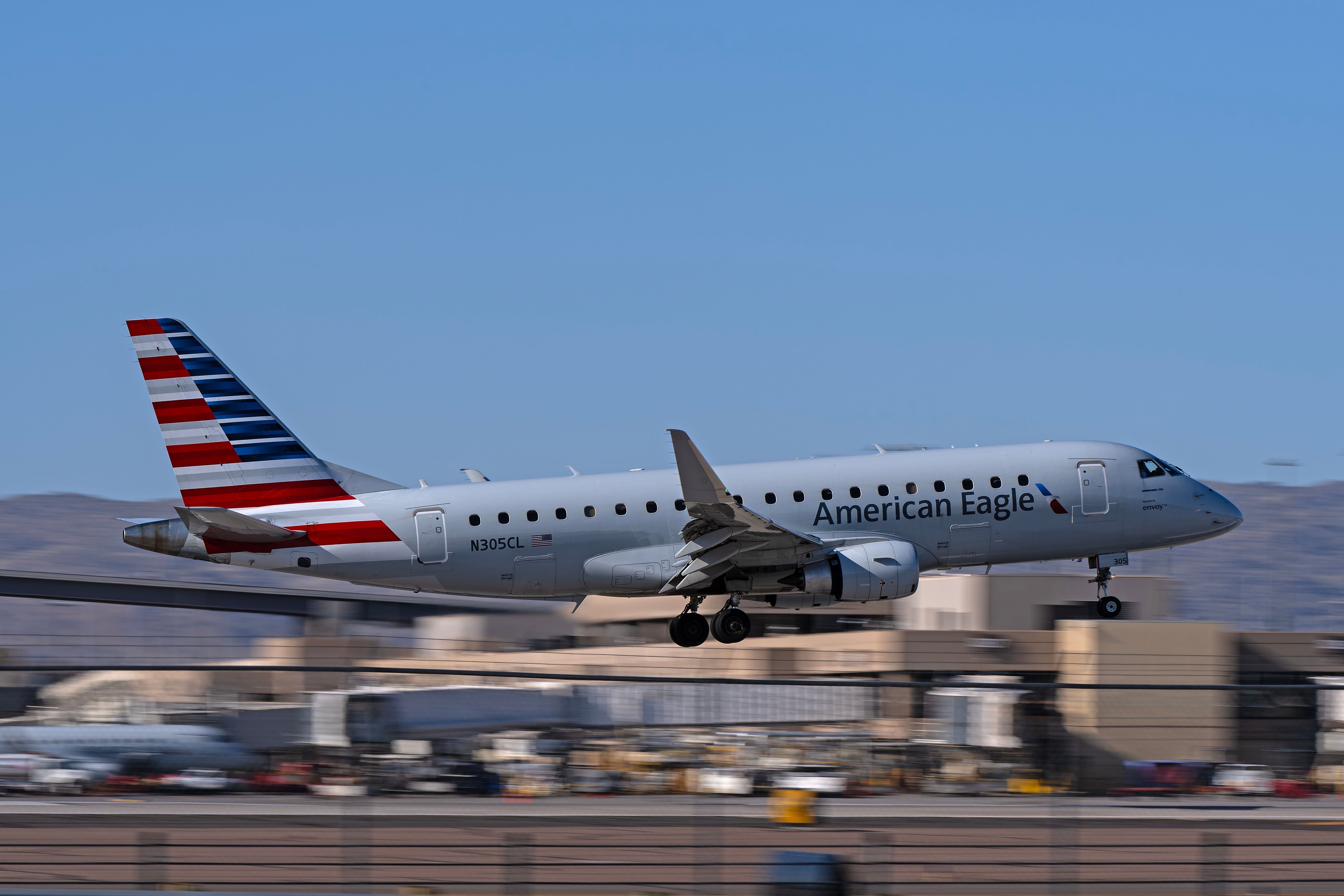 American Eagle (Envoy Air) Embraer E175 N305CL landing at Phoenix Sky Harbor International Airport.