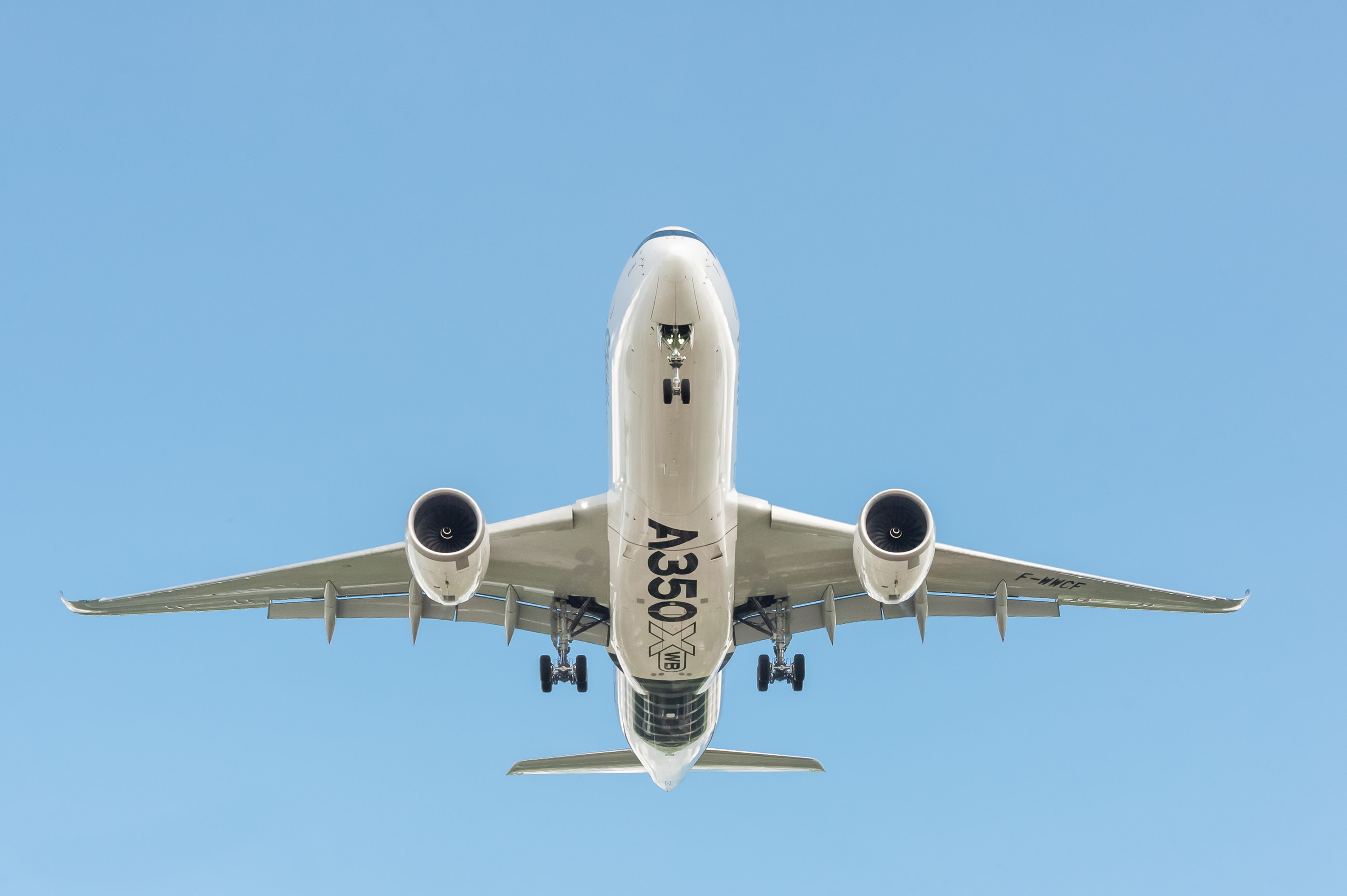 An Airbus A350 landing overhead