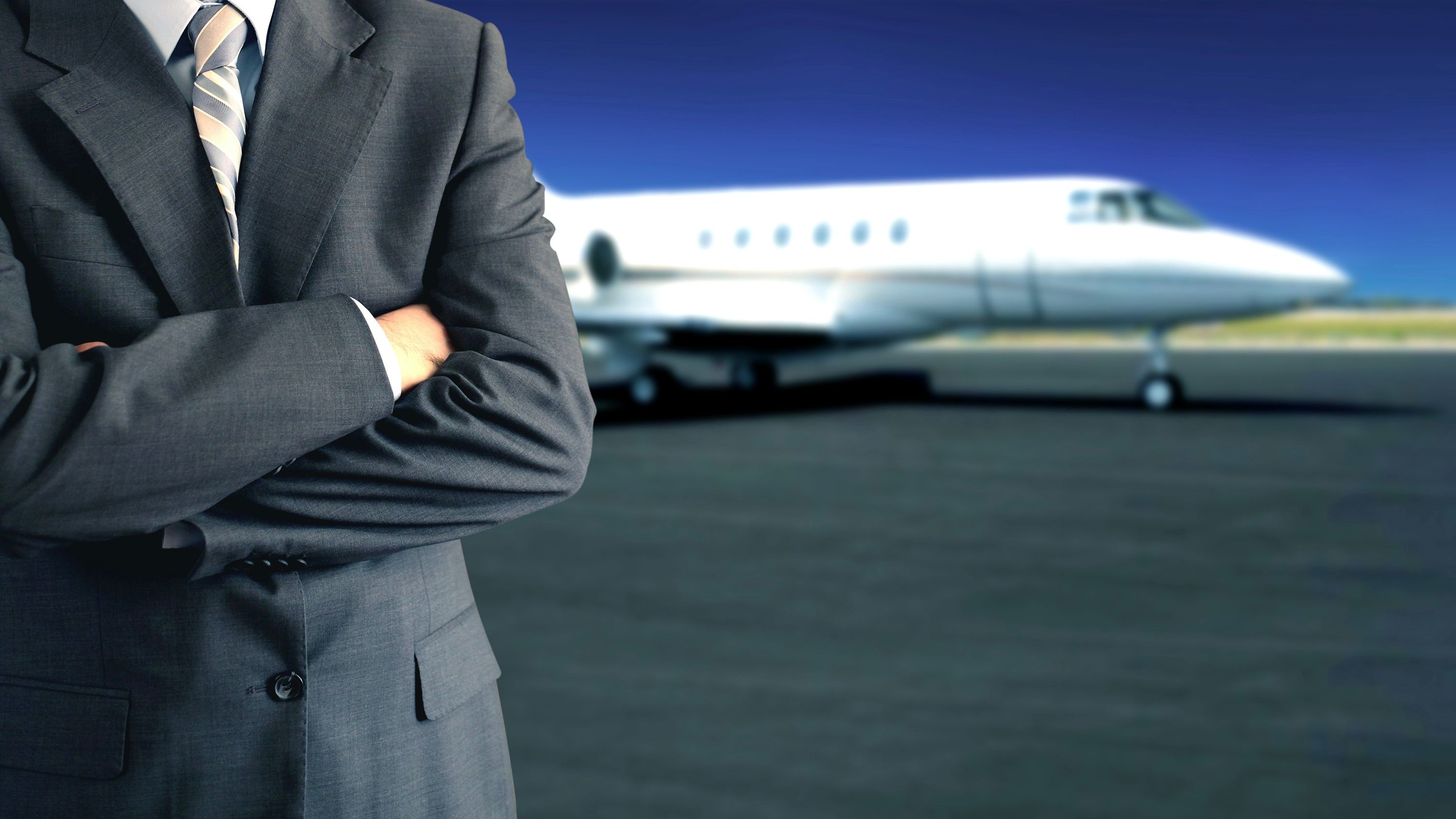 business man in front of business jet