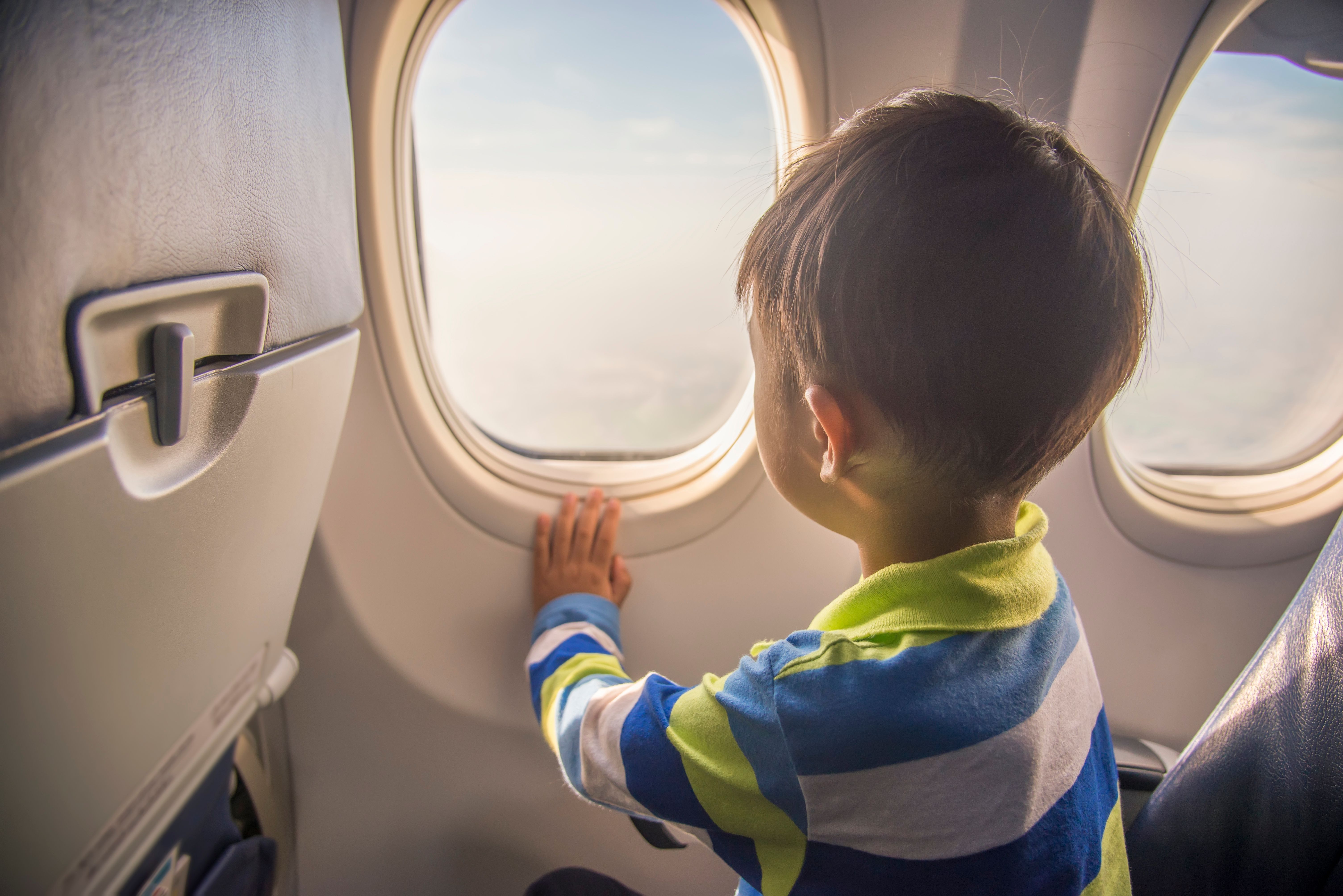 child on plane shutterstock_773989927