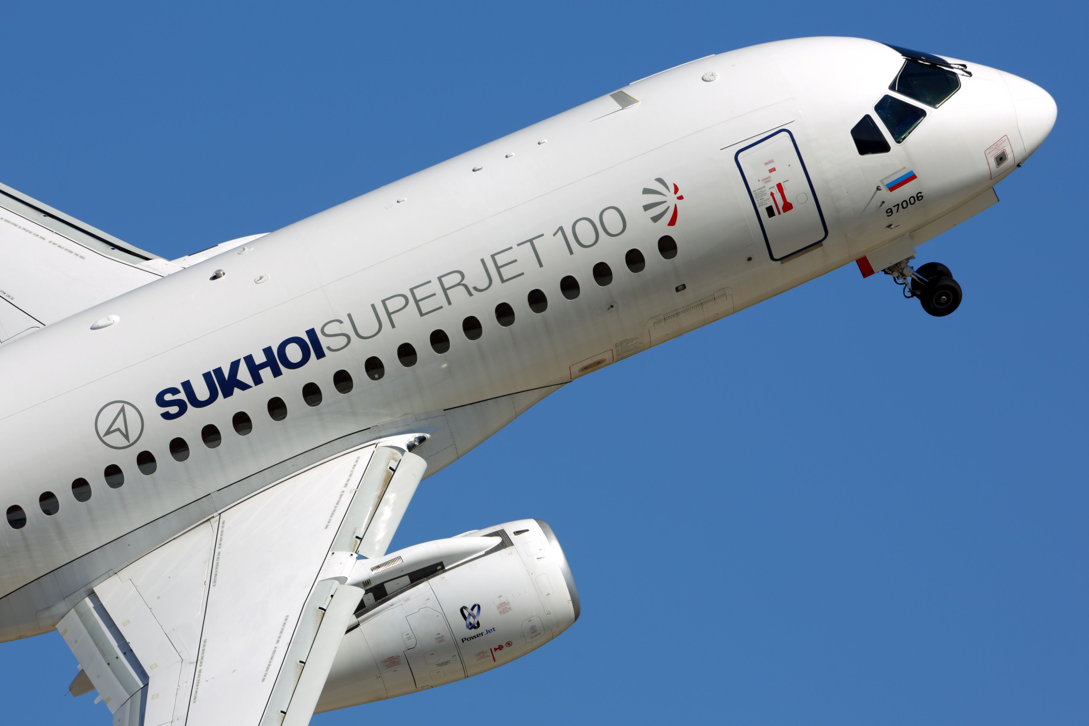 Sukhoi Superjet 100 in flight shutterstock_347534399