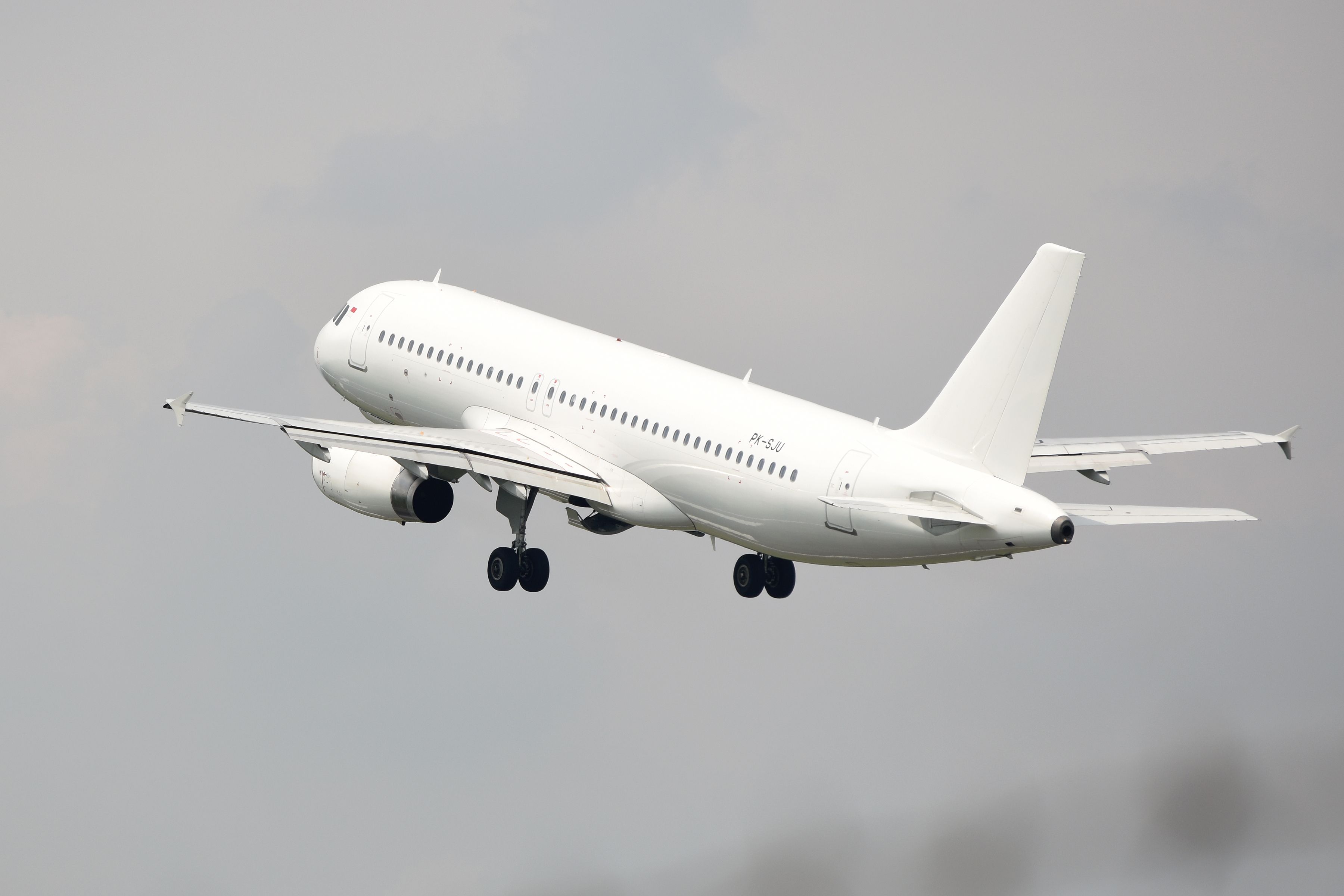 White Airbus A320 taking off in Indonesia shutterstock_2152927321