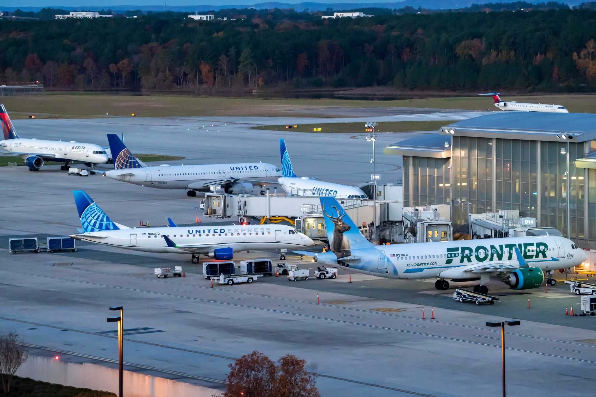 Several airplanes at the gates at Raleigh-Durham International Airport.