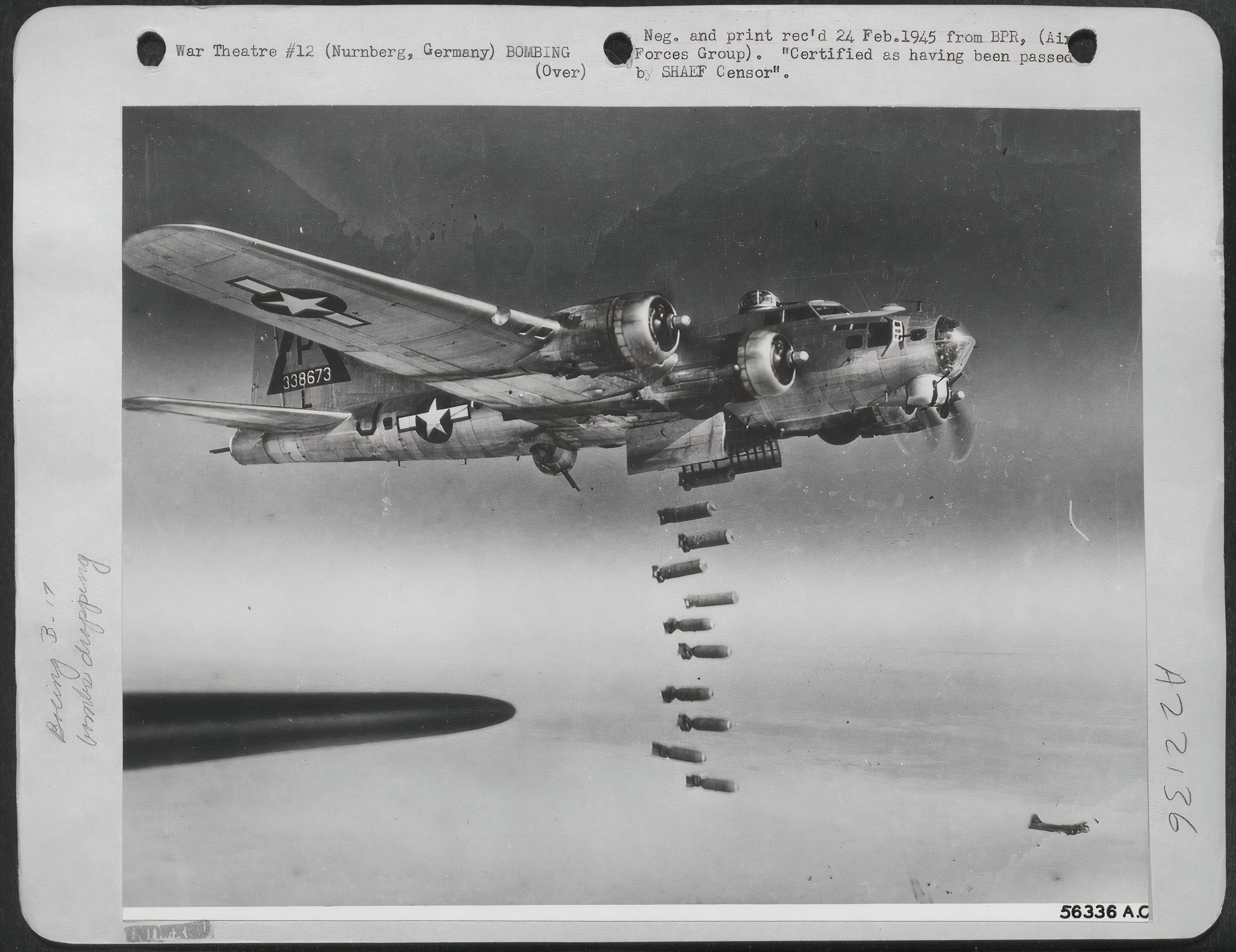 Black and White photo of a B-17 Dropping bombs over Nurnberg, Germany.