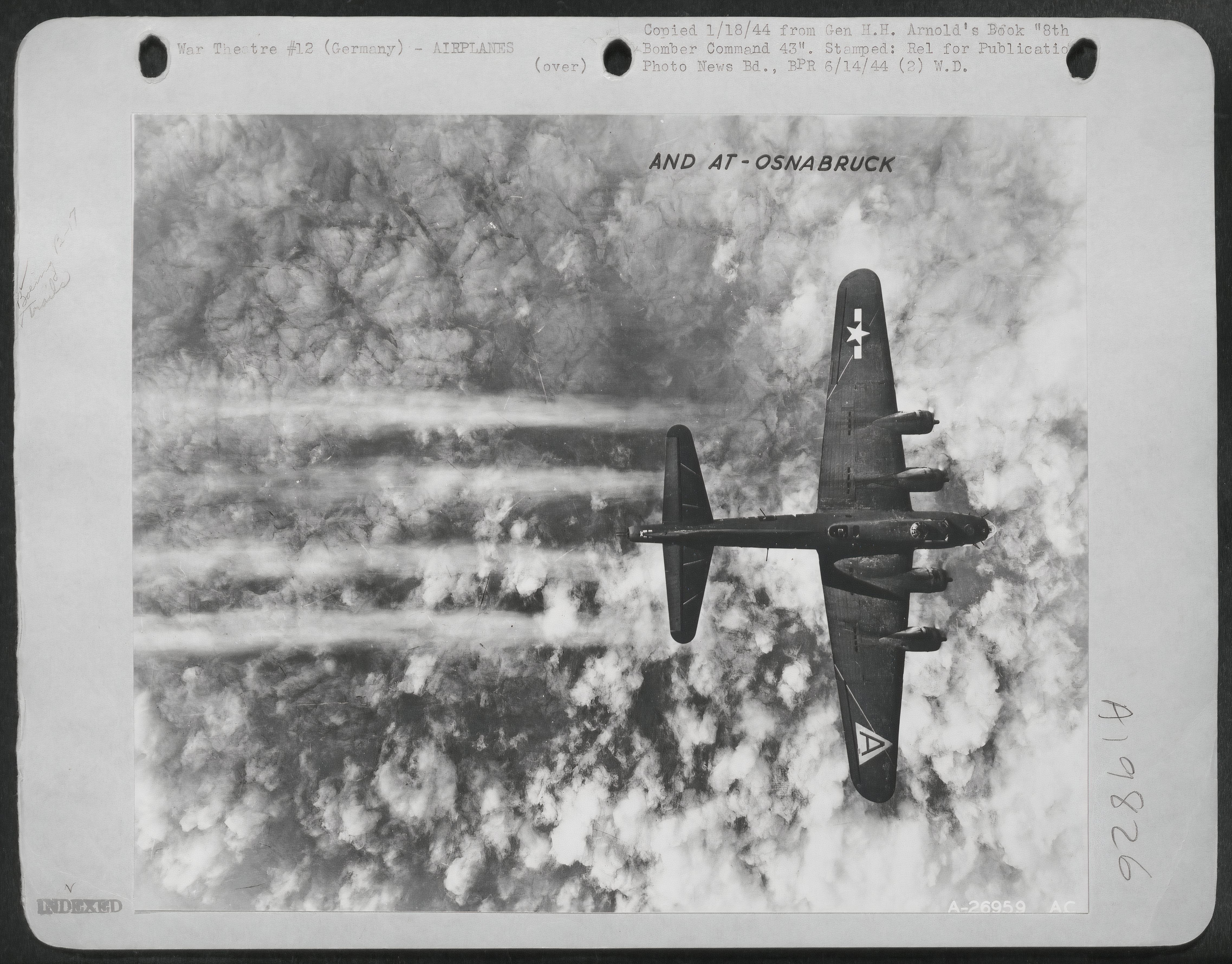 Black and White photo of a Boeing B-17 Flying Fortress over Osnabruck, Germany.