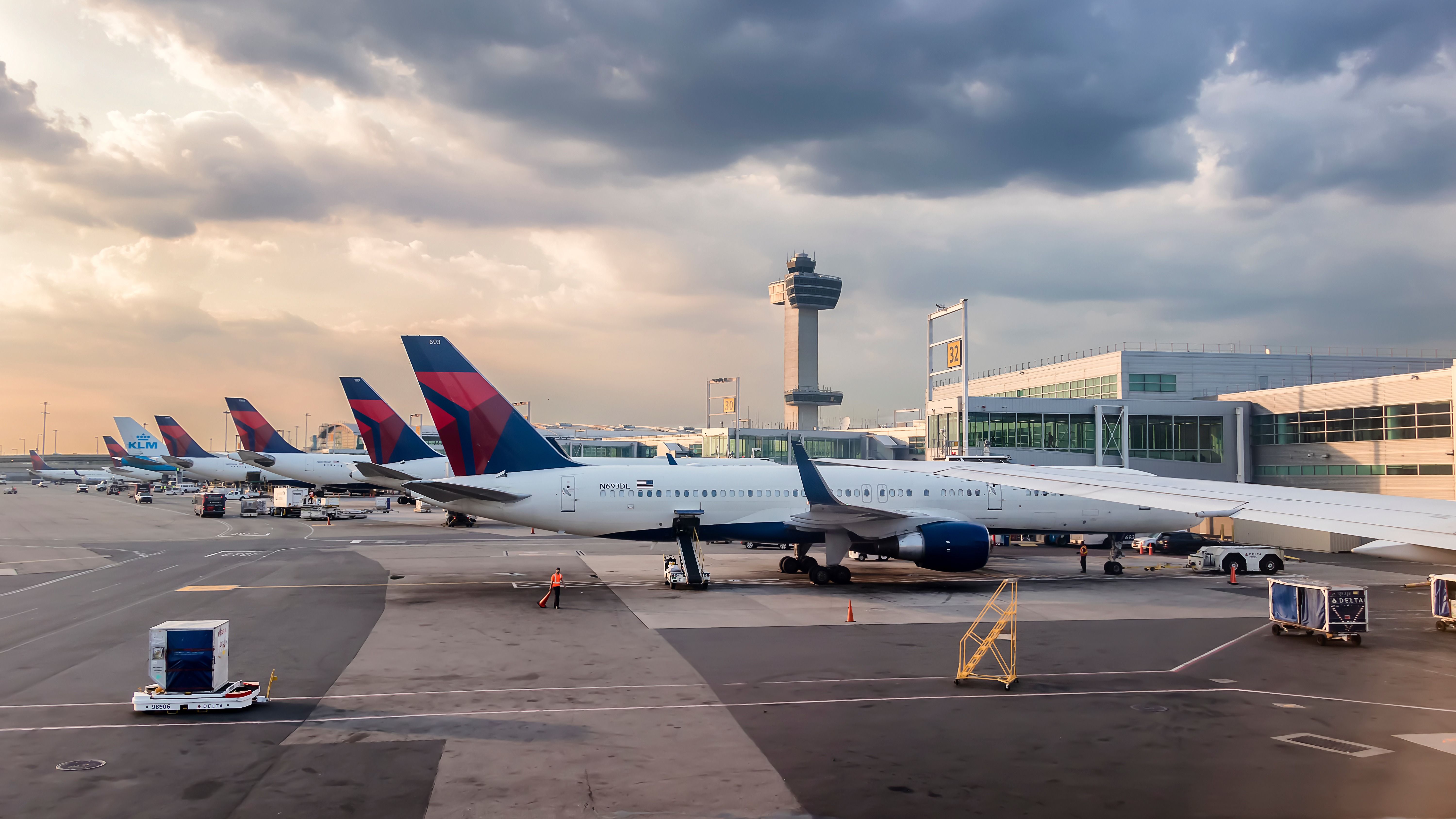 Delta Air Lines aircraft parked at the gates at JFK shutterstock_1017102973