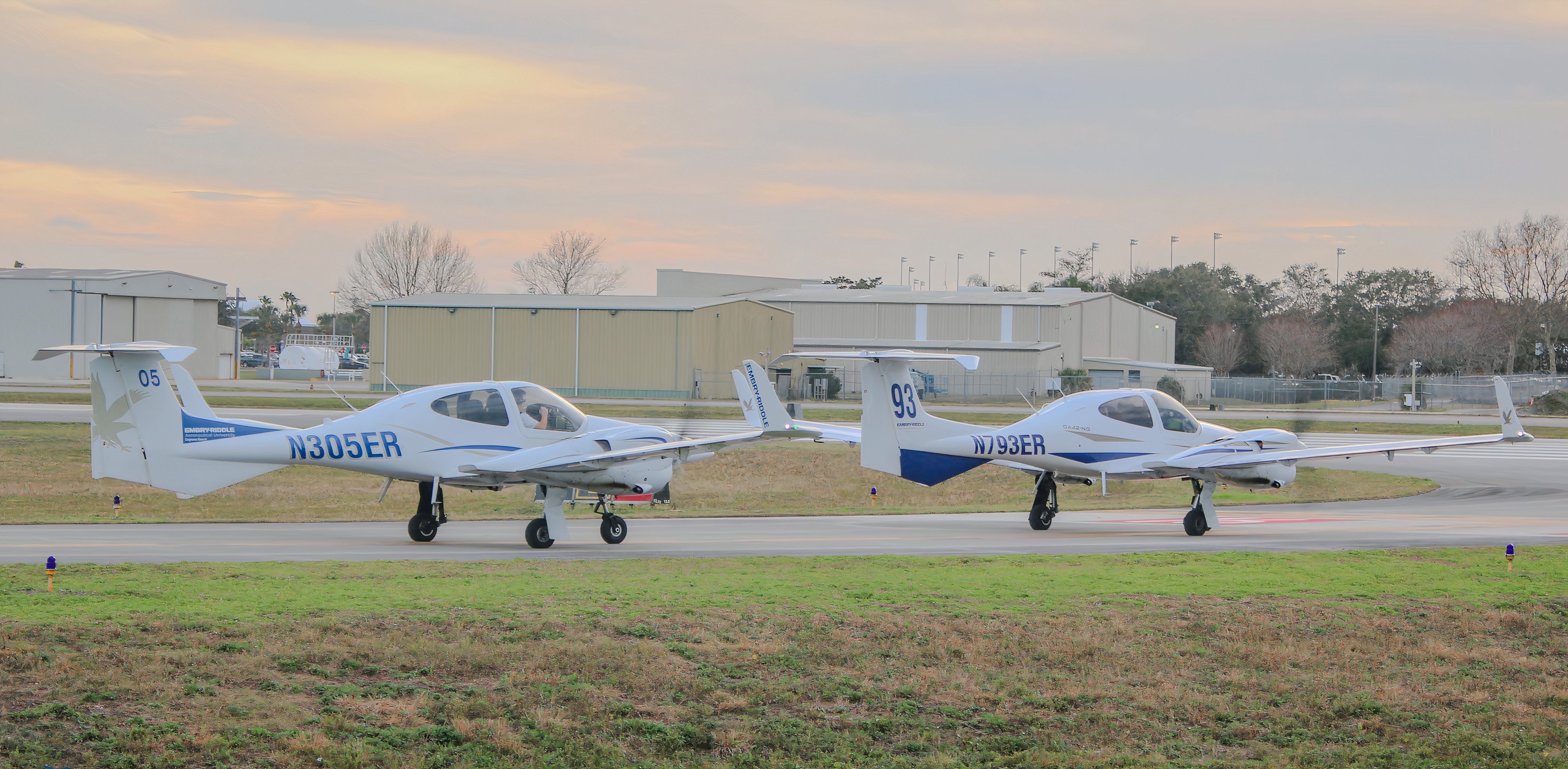 Two Diamond DA-42 Twin Stars holding short of runway 16 at KDAB.