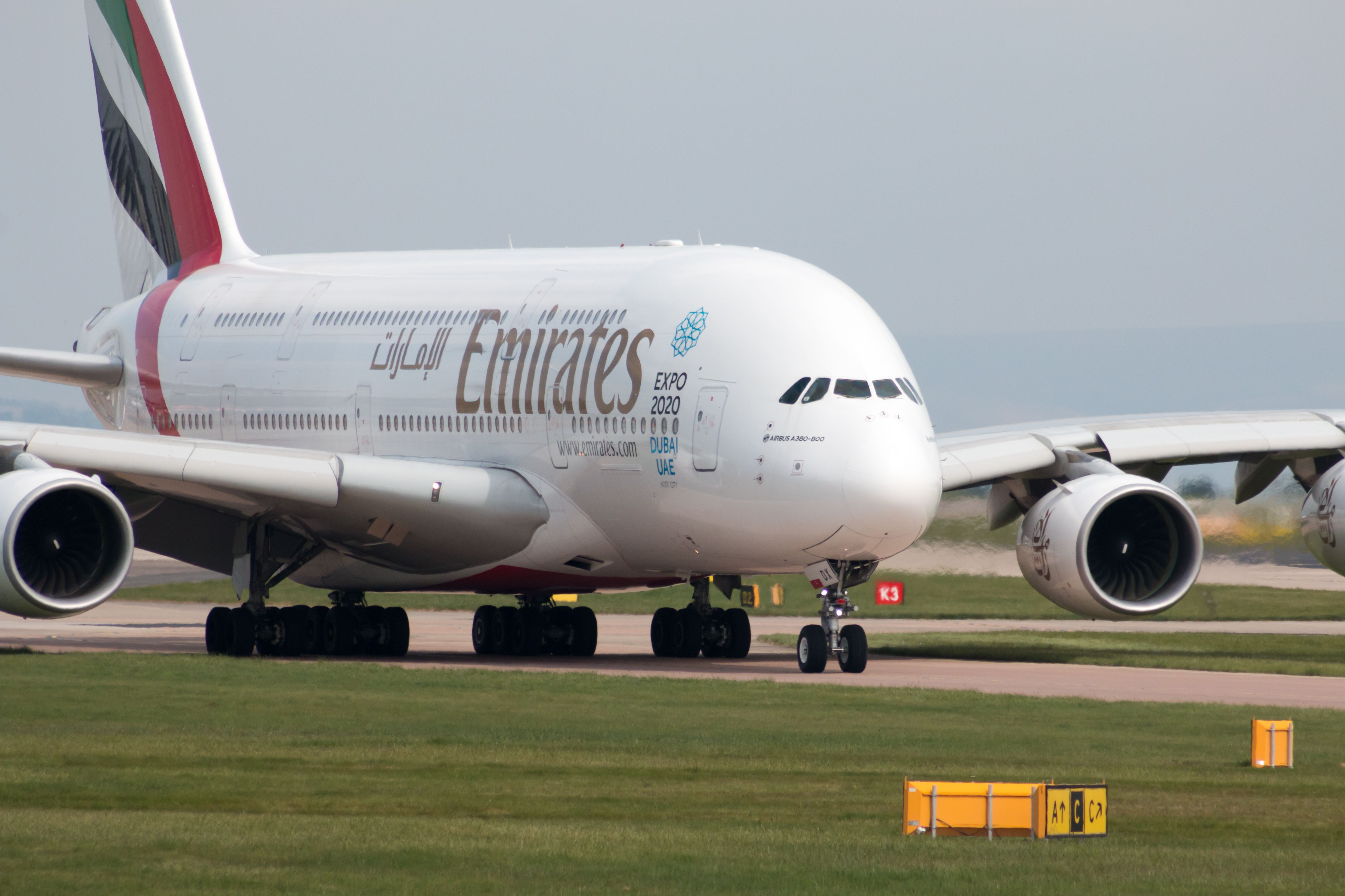 Emirates Airbus A380 A6-EDX taxiing at Manchester Airport MAN shutterstock_523867453