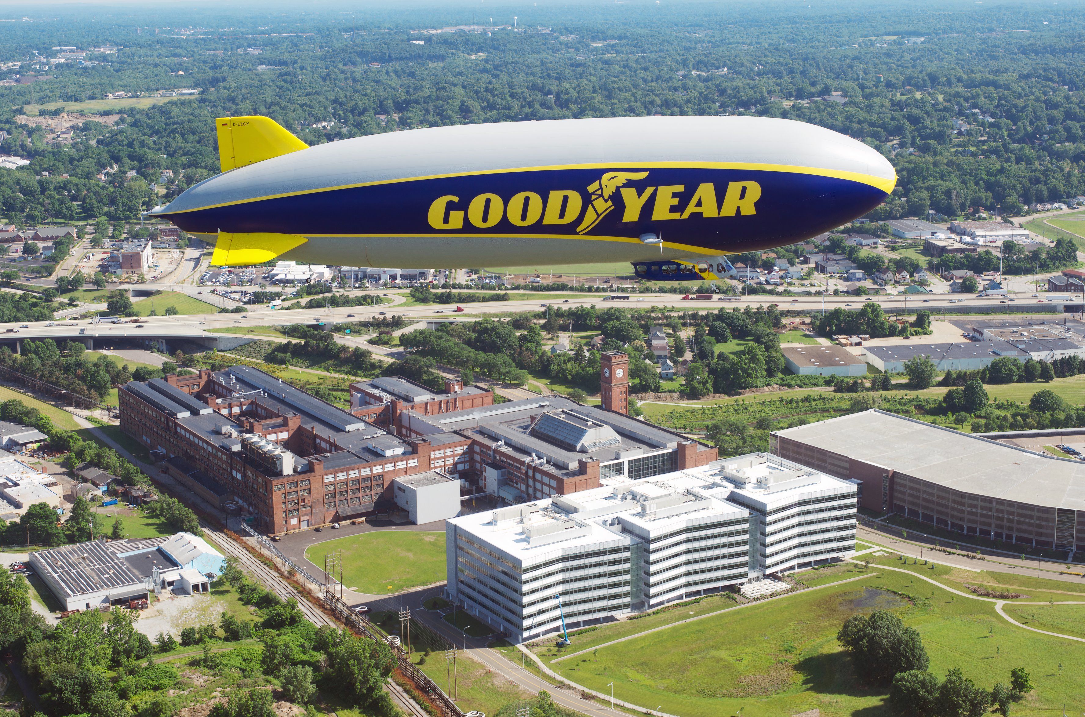 Goodyear blimp flying over company headquarters in Akron