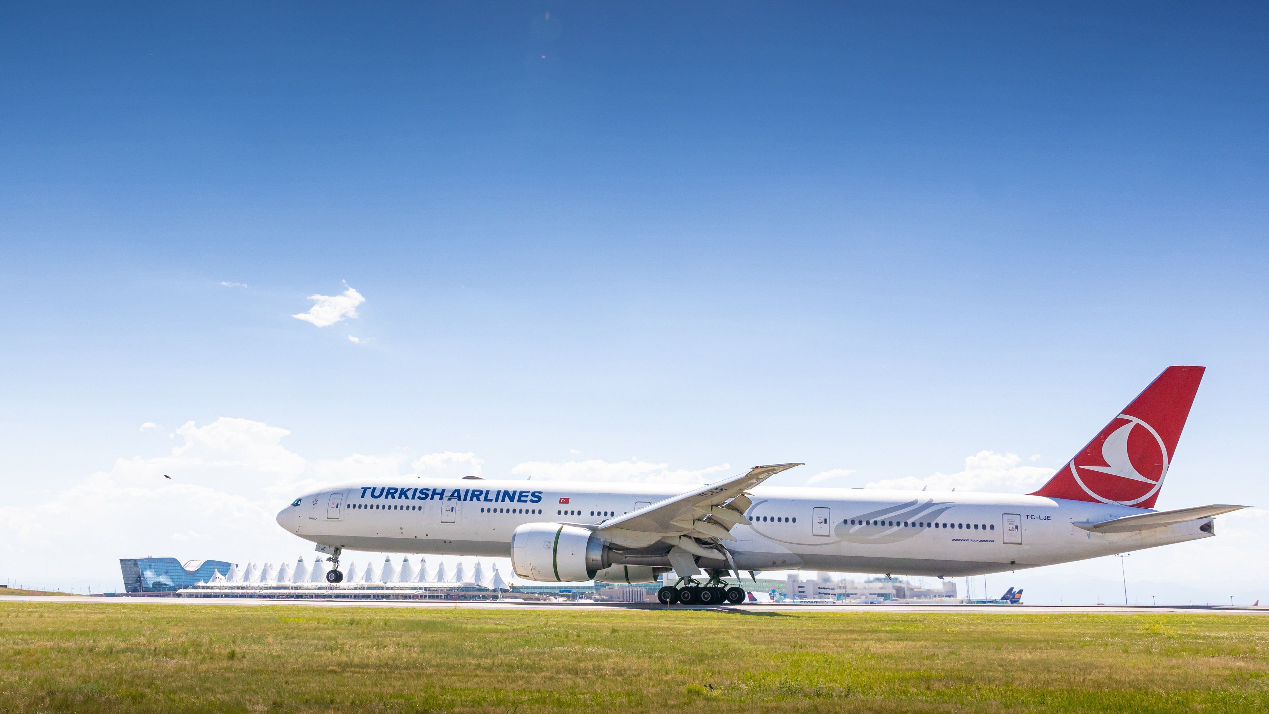 Turkish Airlines Boeing 777-300ER landing at Denver International Airport.