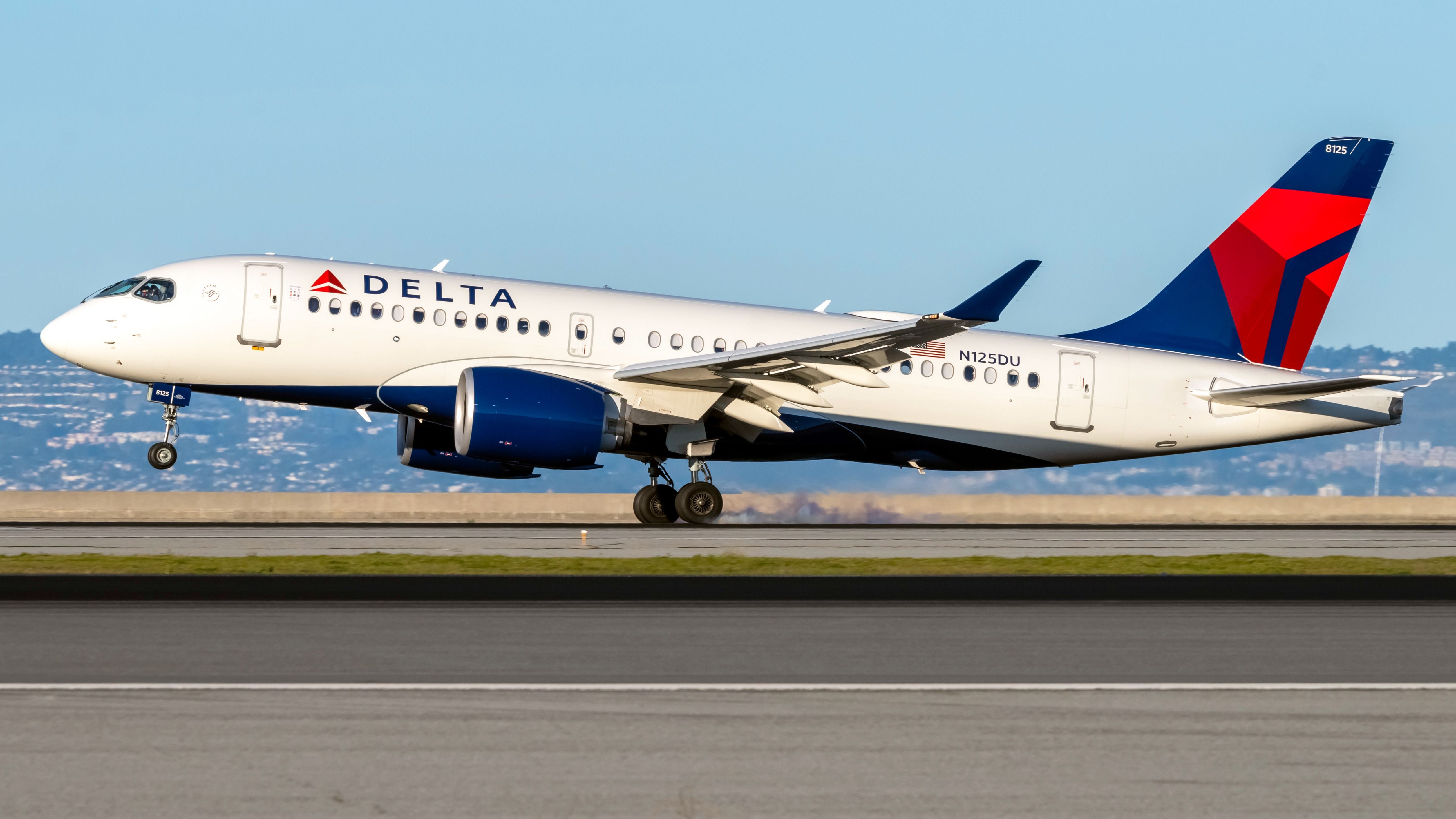 Delta Air Lines Airbus A220-100 (N125DU) landing at San Francisco International Airport. 