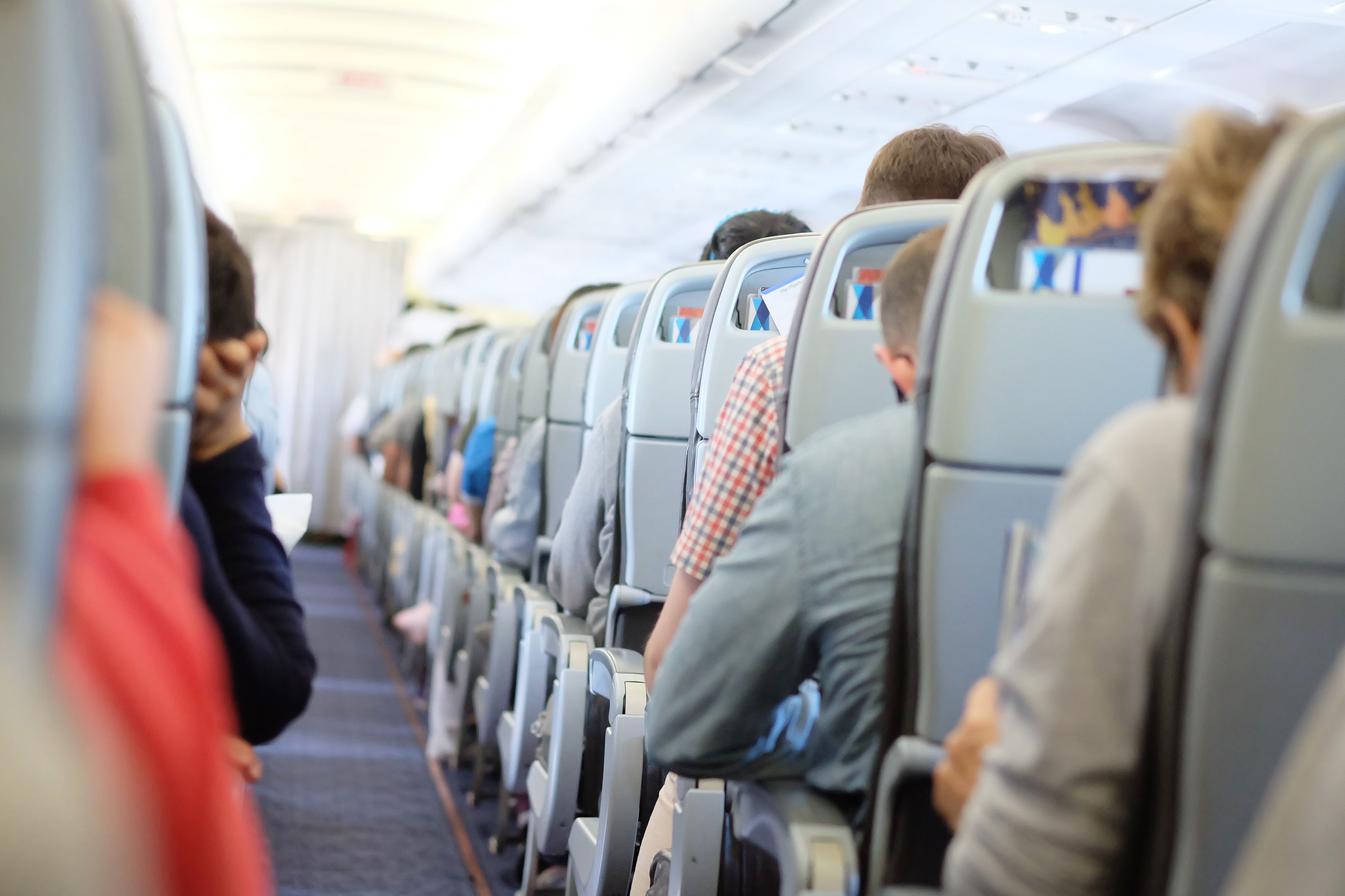 Passengers on an aircraft shutterstock_376099216