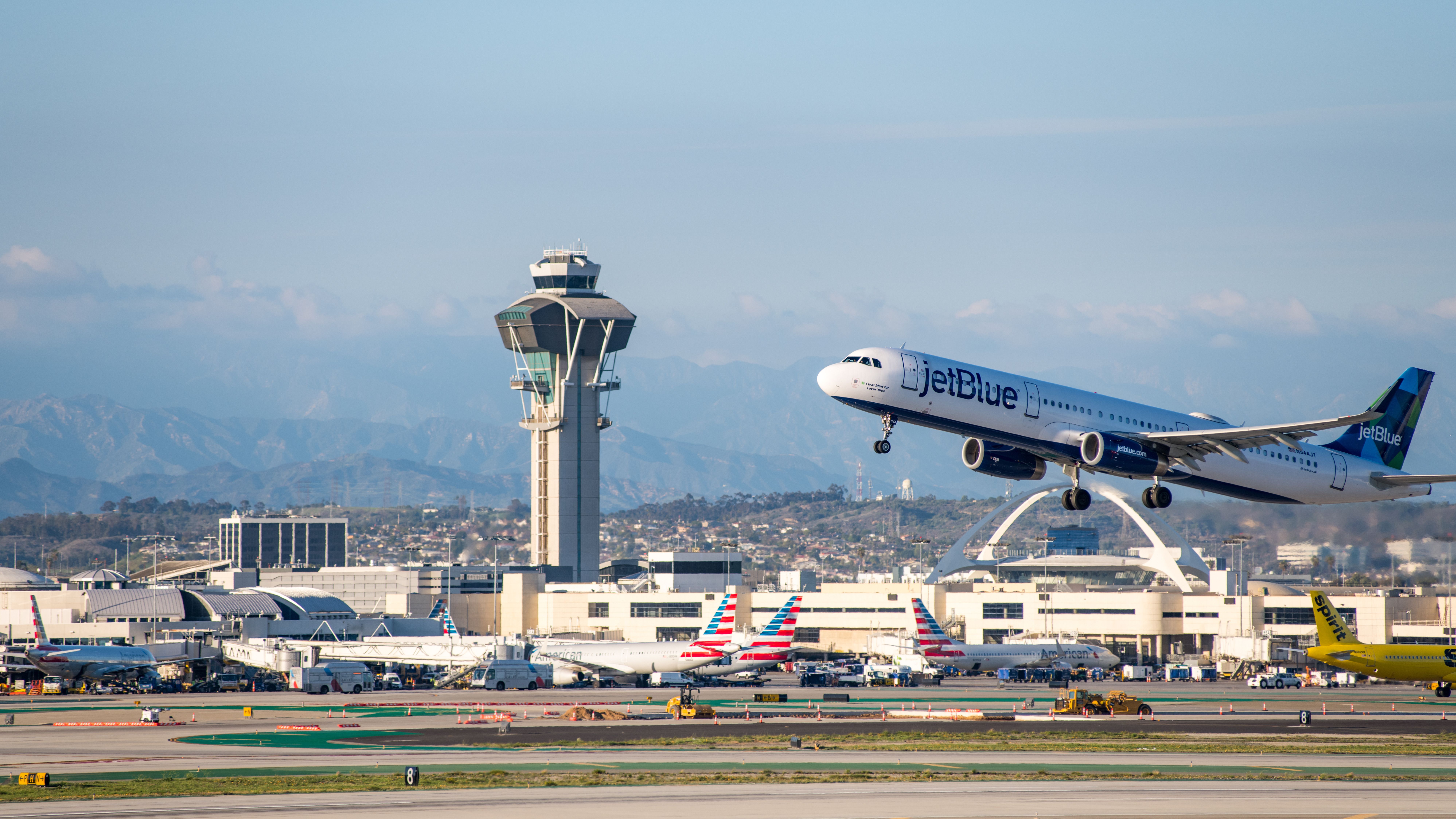 A Jetblue Airline airplane taking off at Los Angeles International Airport.