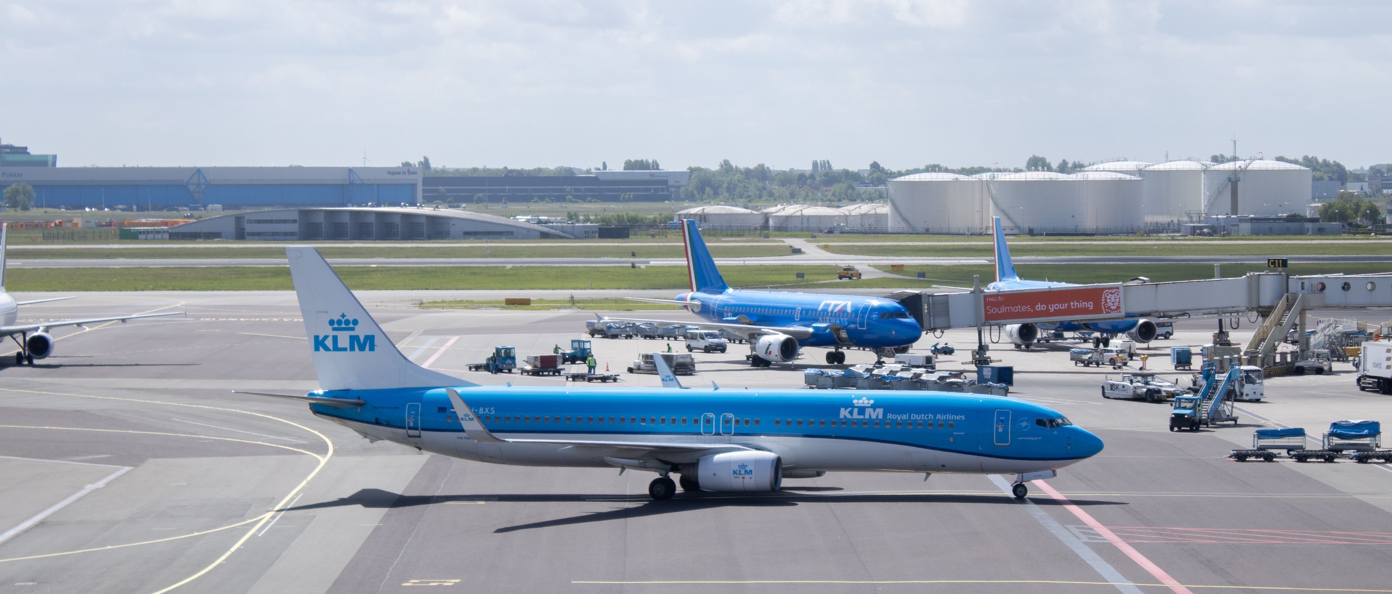 Schiphol, Netherlands - May 26, 2022: A KLM Royal Dutch Airlines Boeing 737-900 aircraft taxis to the gate after landing at Amsterdam Schiphol Airport. A cloudy sky in the background.