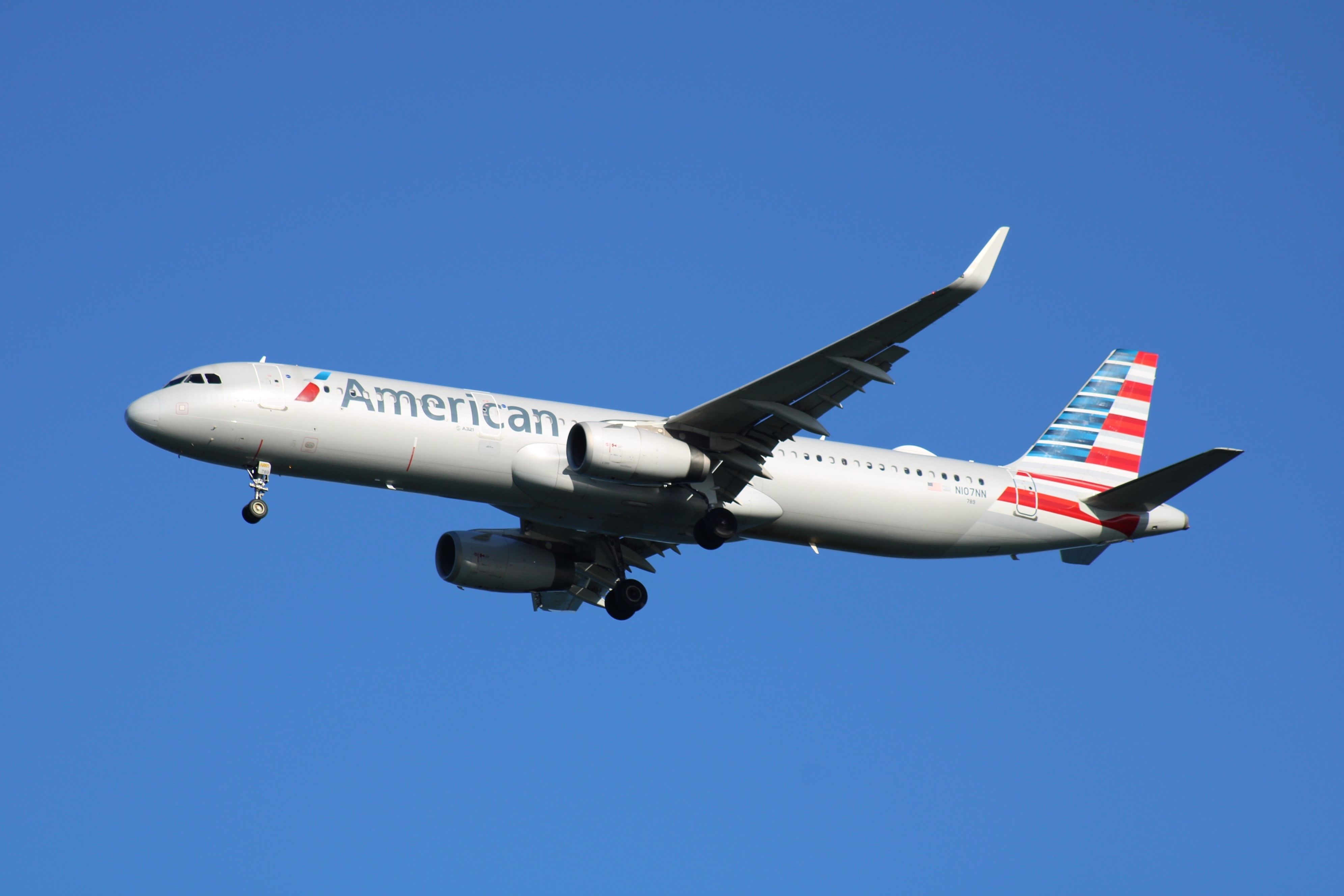 Airbus A321T (N107NN) of American Airlines on approach to Boston Logan International Airport.