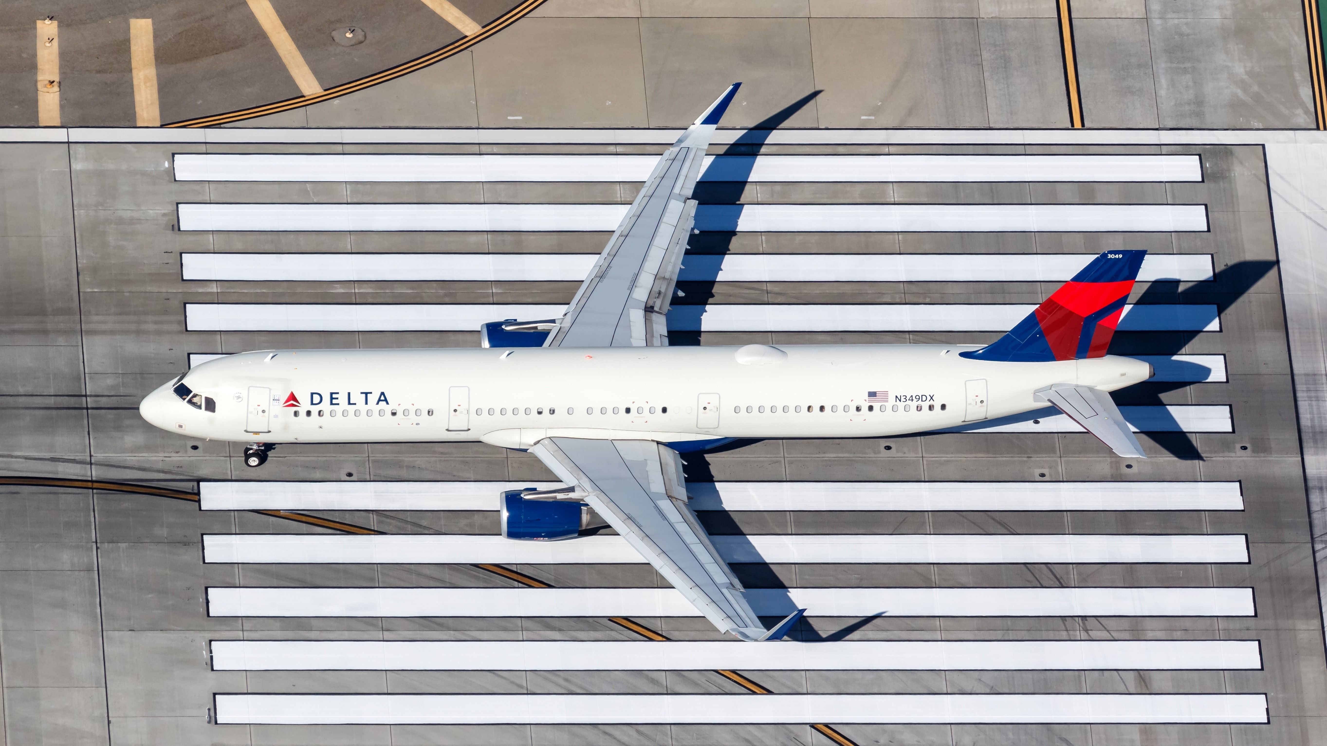 Delta Air Lines Airbus A321 airplane at Los Angeles airport (LAX) in the United States aerial view.