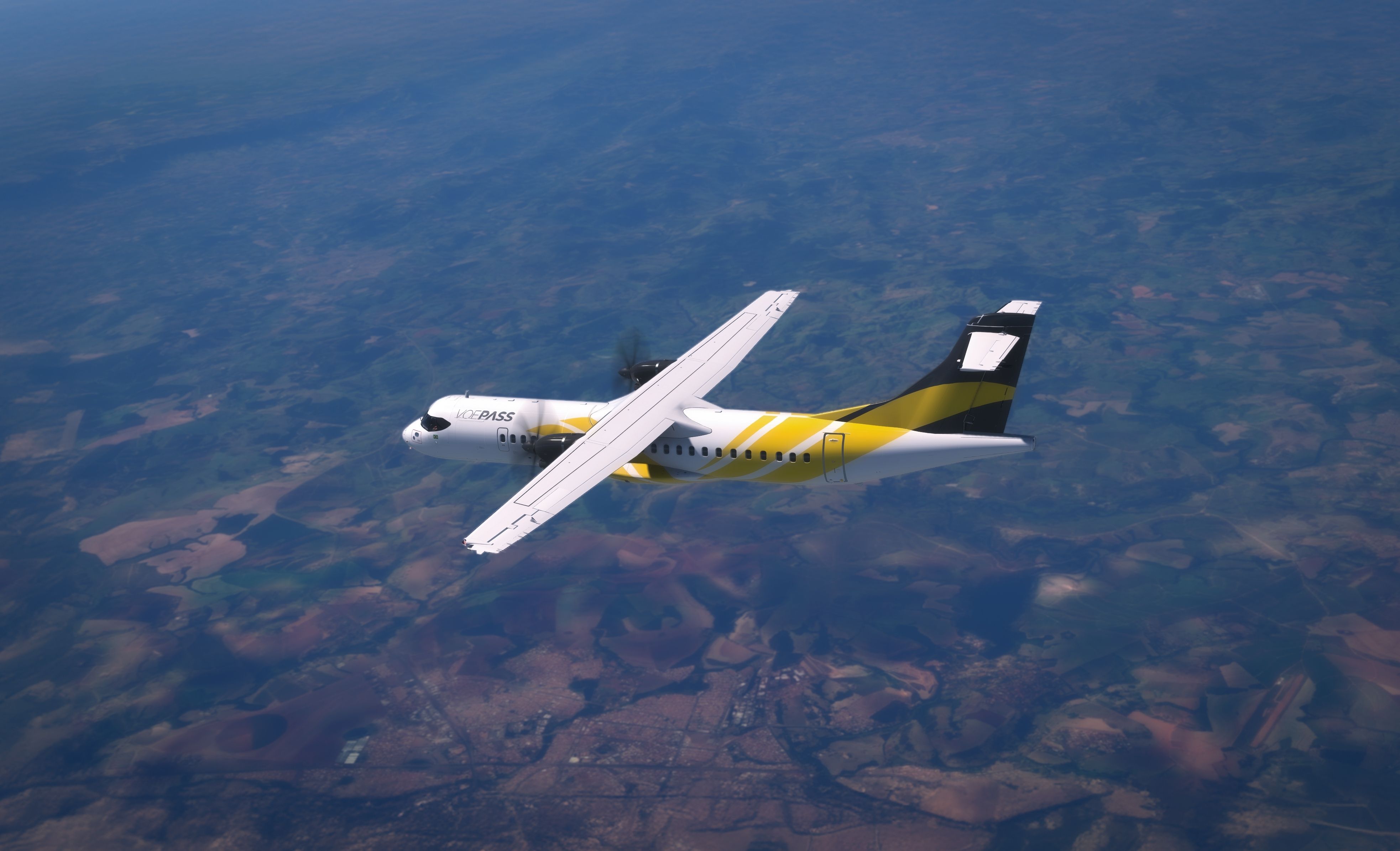 A Voepass ATR 72 flies in the sky