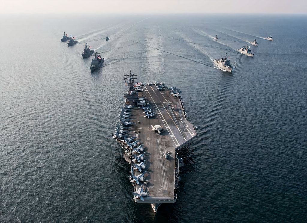 USS Ronald Reagan aircraft carrier steams in formation with ships from Carrier Strike Group