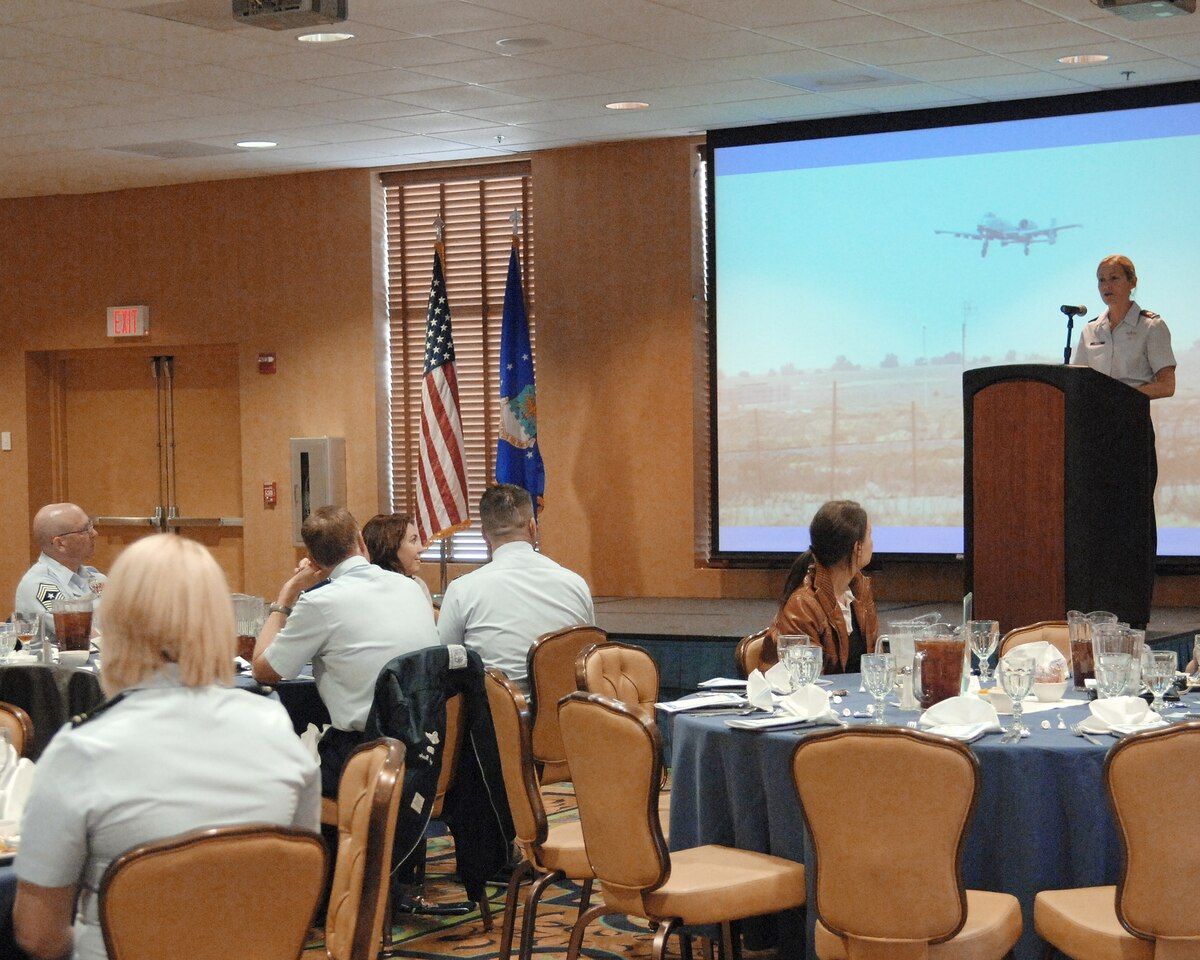 Then-Maj Kim (KC) Campbell speaks to Womens History Month luncheon guests in 2010