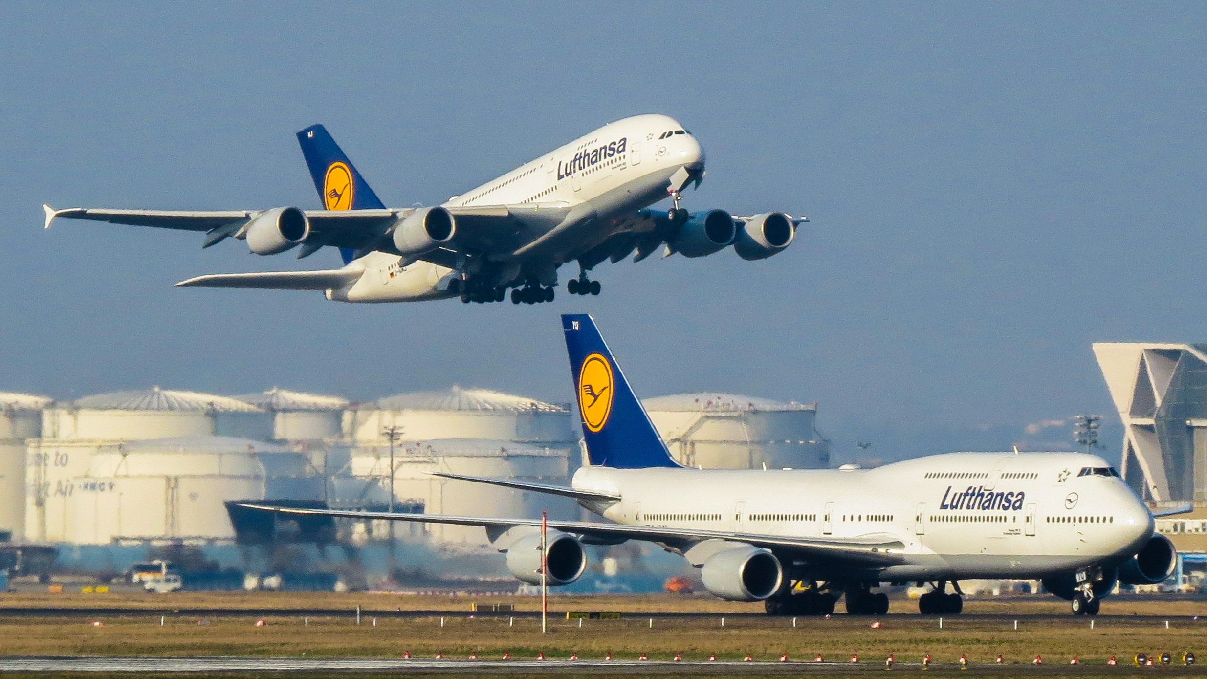 Lufthansa Airbus A380 Taking Off Above Boeing 747