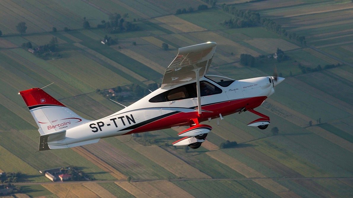 Tecnam P2010 flying in the sky