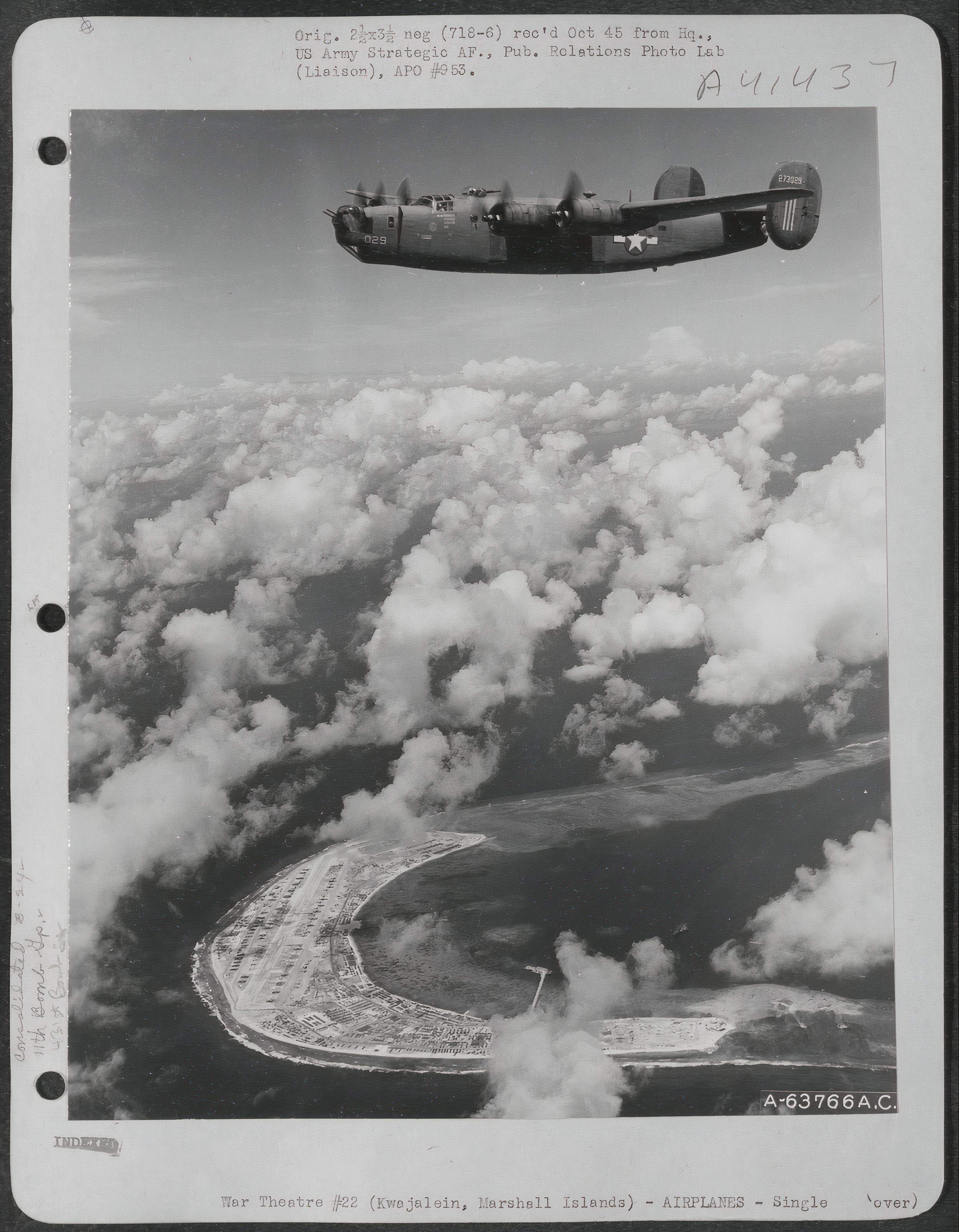 B-24 of the 11th Bomb Group flying over Kwajalin, Marshall Islands, June 1944.