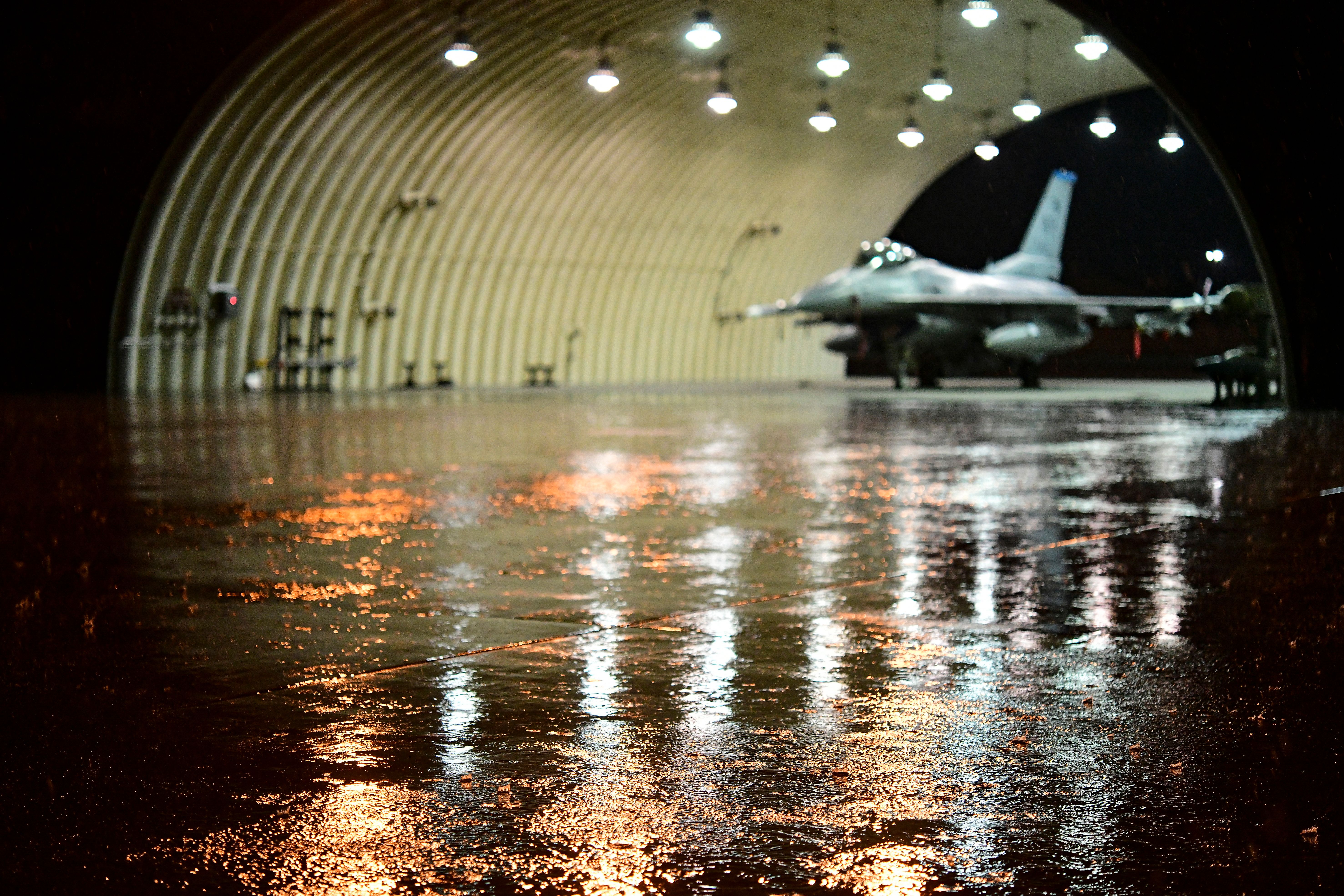 7160115 - An F-16 Fighting Falcon sits in an aircraft flow during routine training at Kunsan Air Base, Republic of Korea, April 25, 2022.